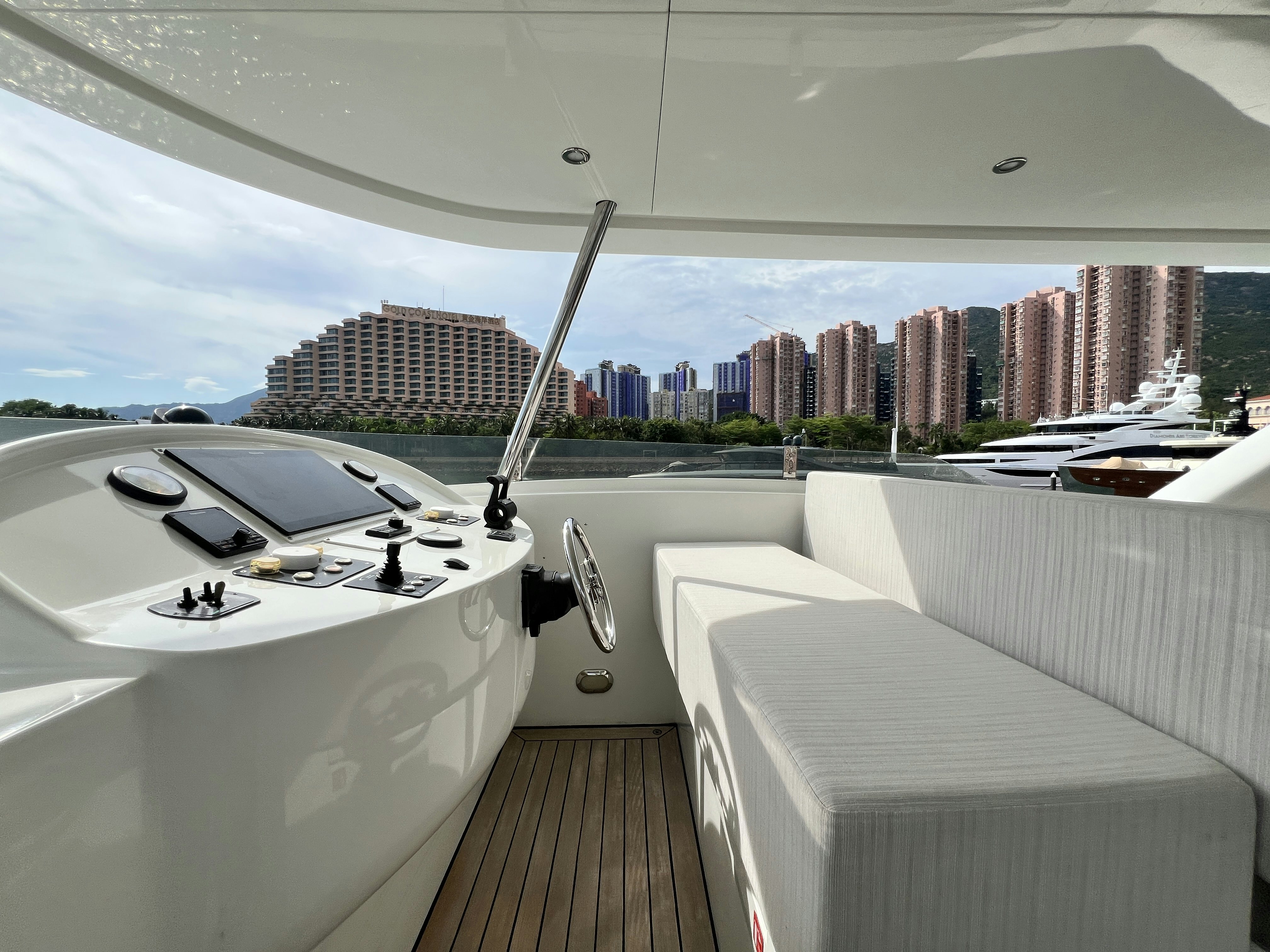 a room with a large white tub and a city skyline aboard SUNRISE Yacht for Sale