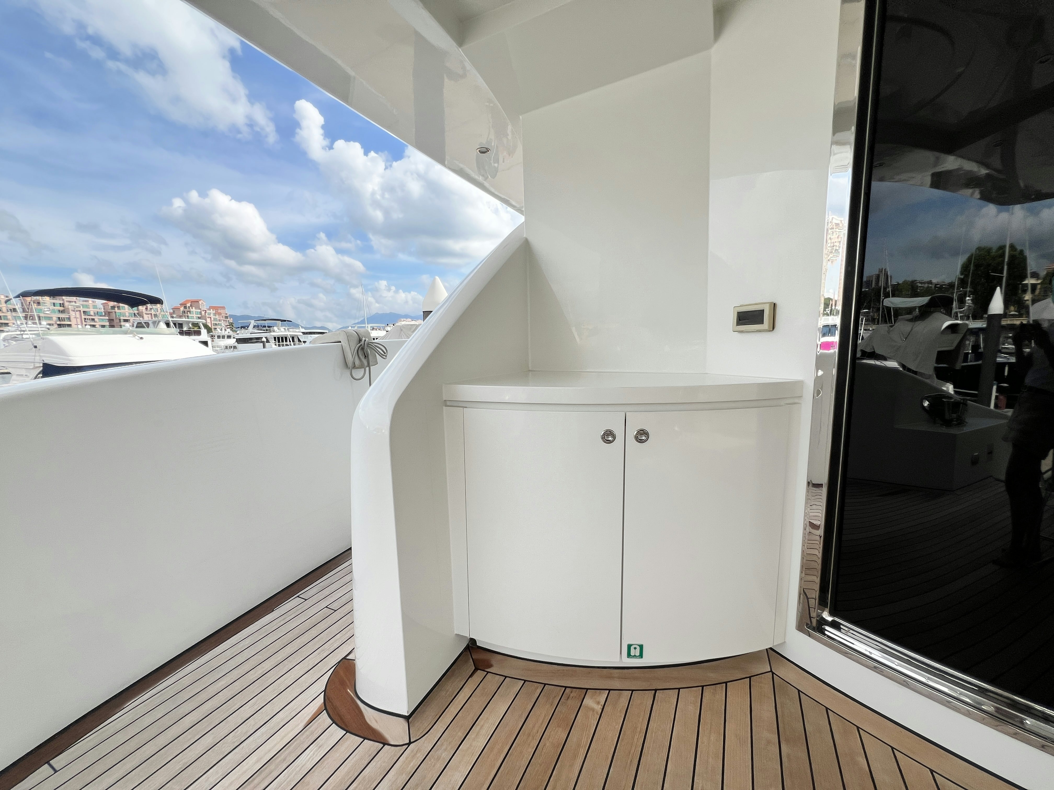 a large white room with a large window and a view of the city aboard SUNRISE Yacht for Sale