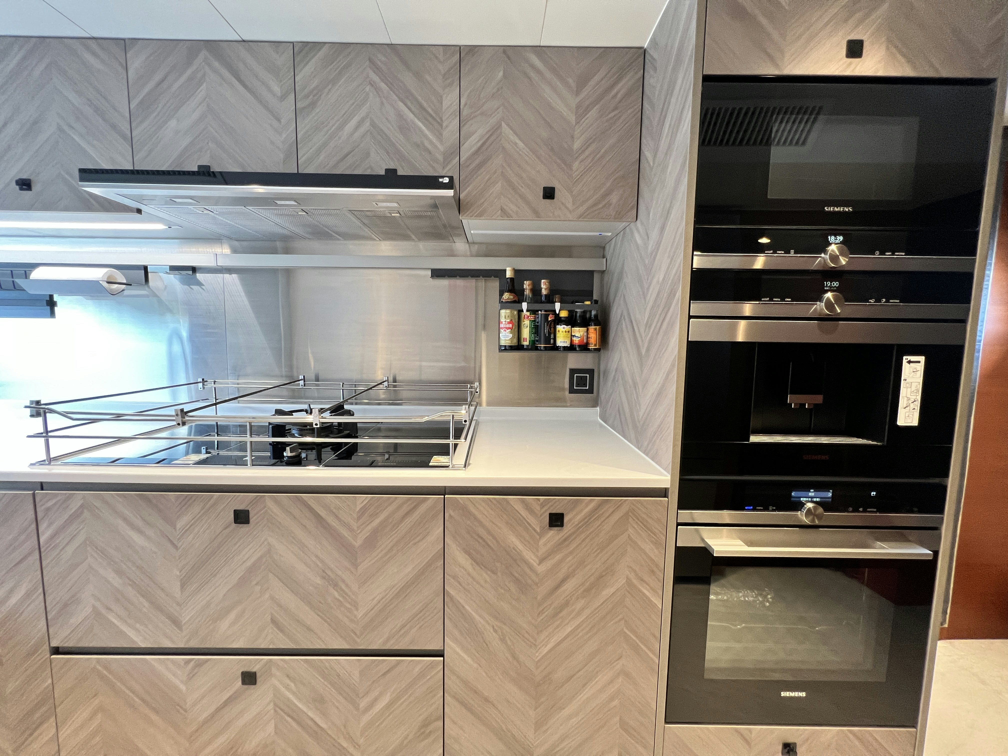 a kitchen with a stove and a microwave aboard SUNRISE Yacht for Sale
