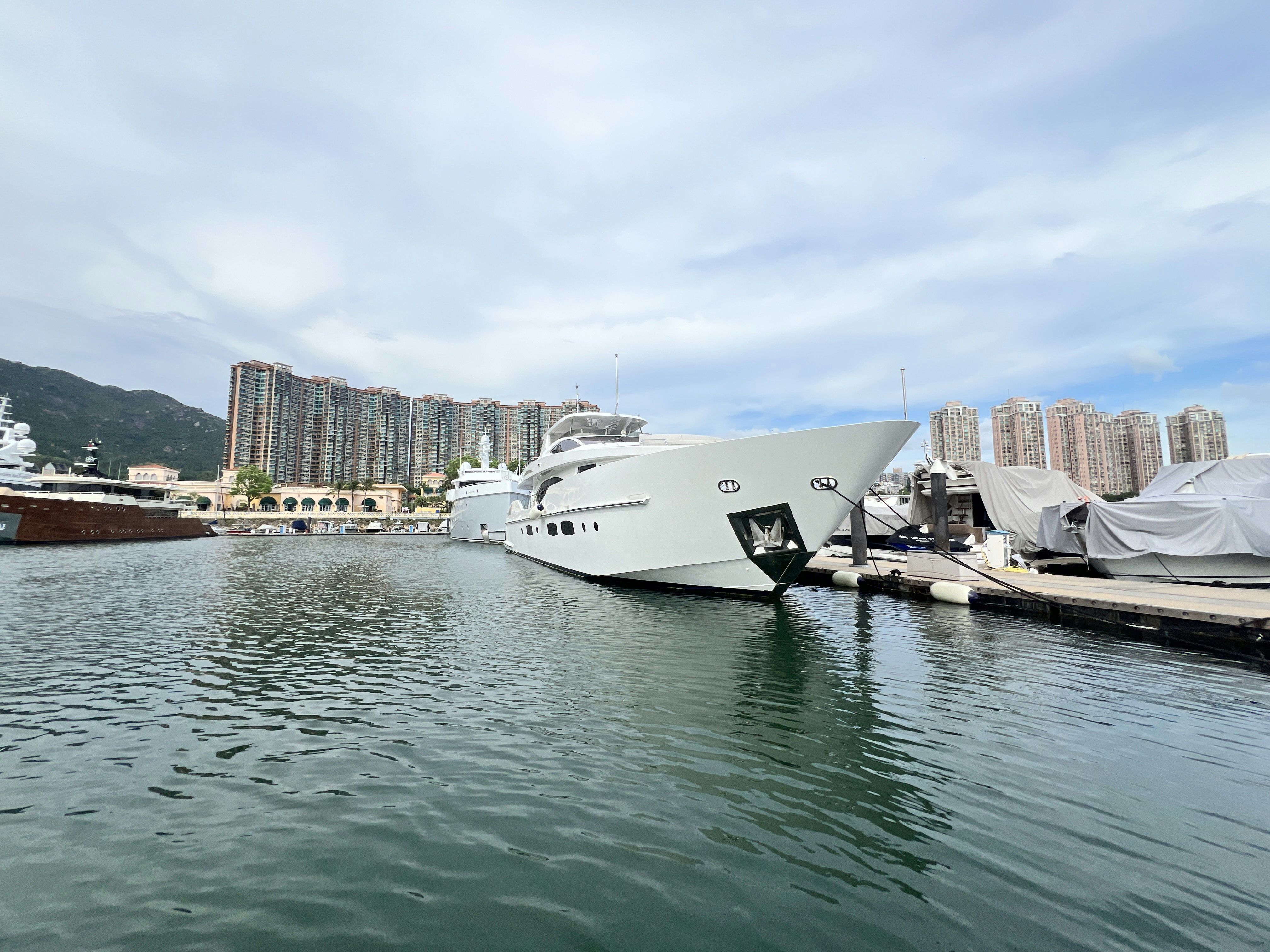 a large white boat sits in the water aboard SUNRISE Yacht for Sale