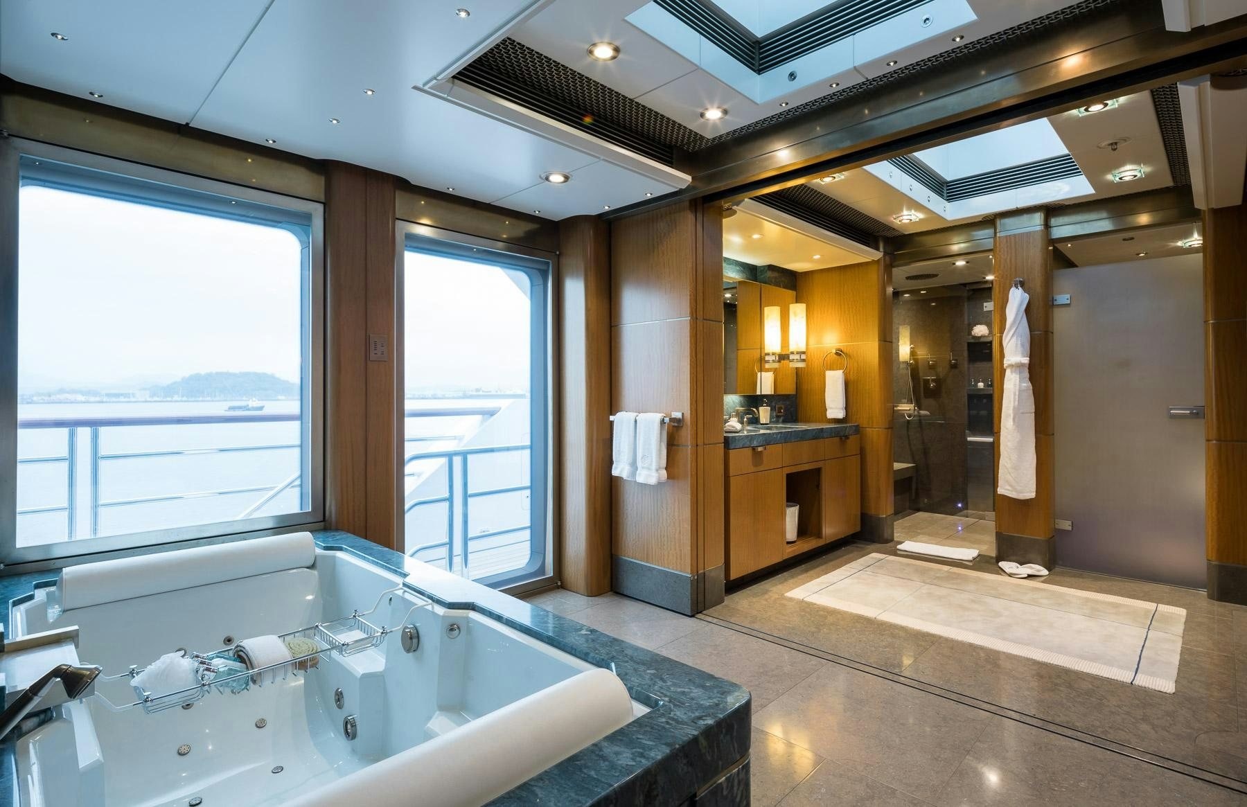 a large bathroom with a large jacuzzi tub aboard OCTOPUS Yacht for Charter
