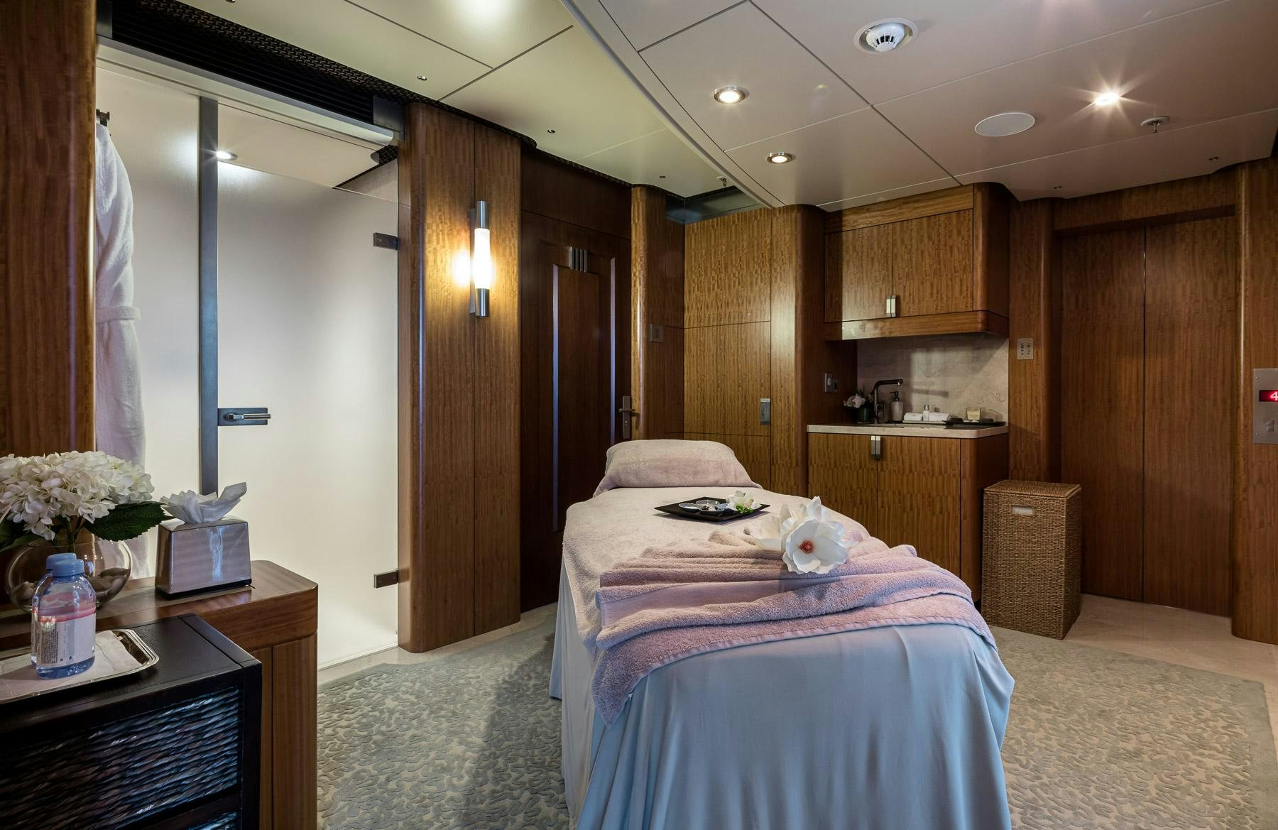 a bedroom with a bed and a desk aboard OCTOPUS Yacht for Charter