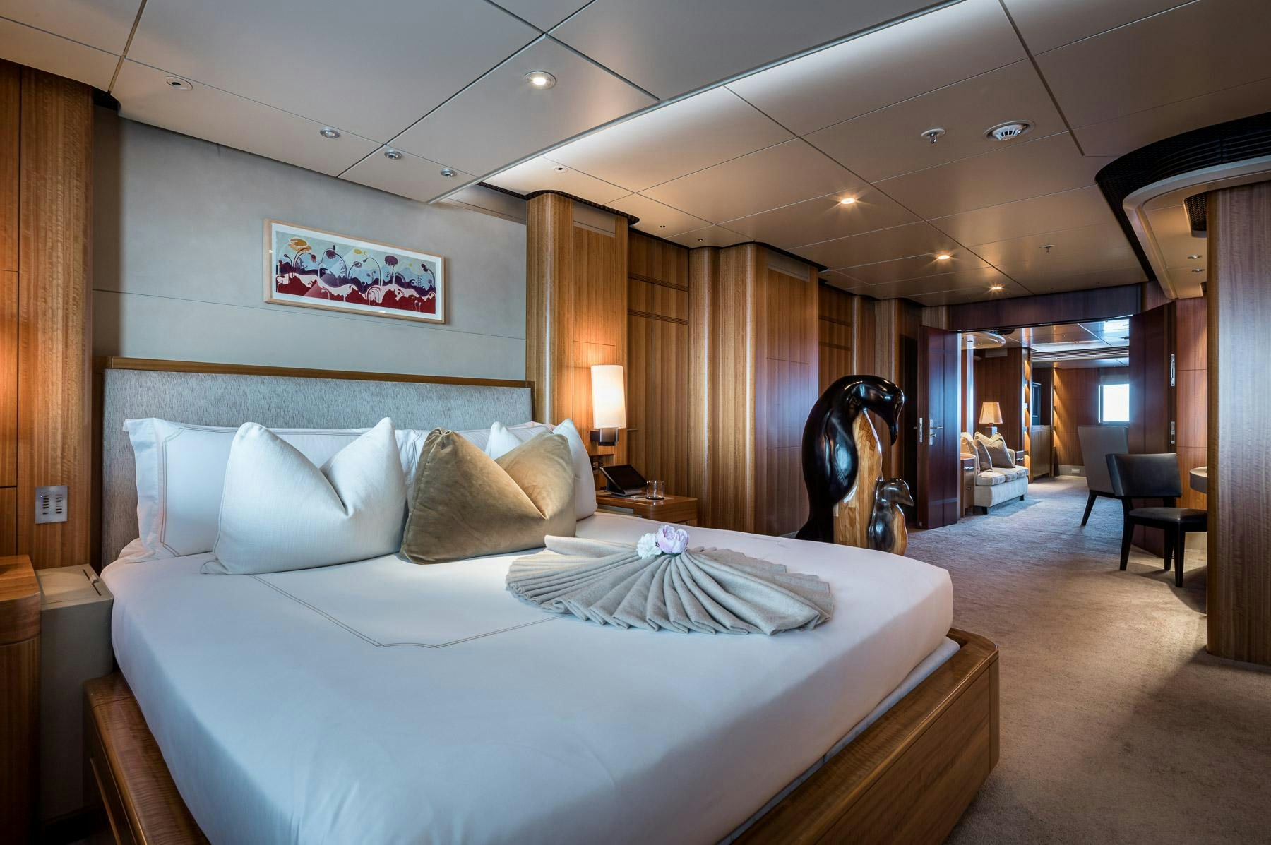 a large bed in a hotel room aboard OCTOPUS Yacht for Charter