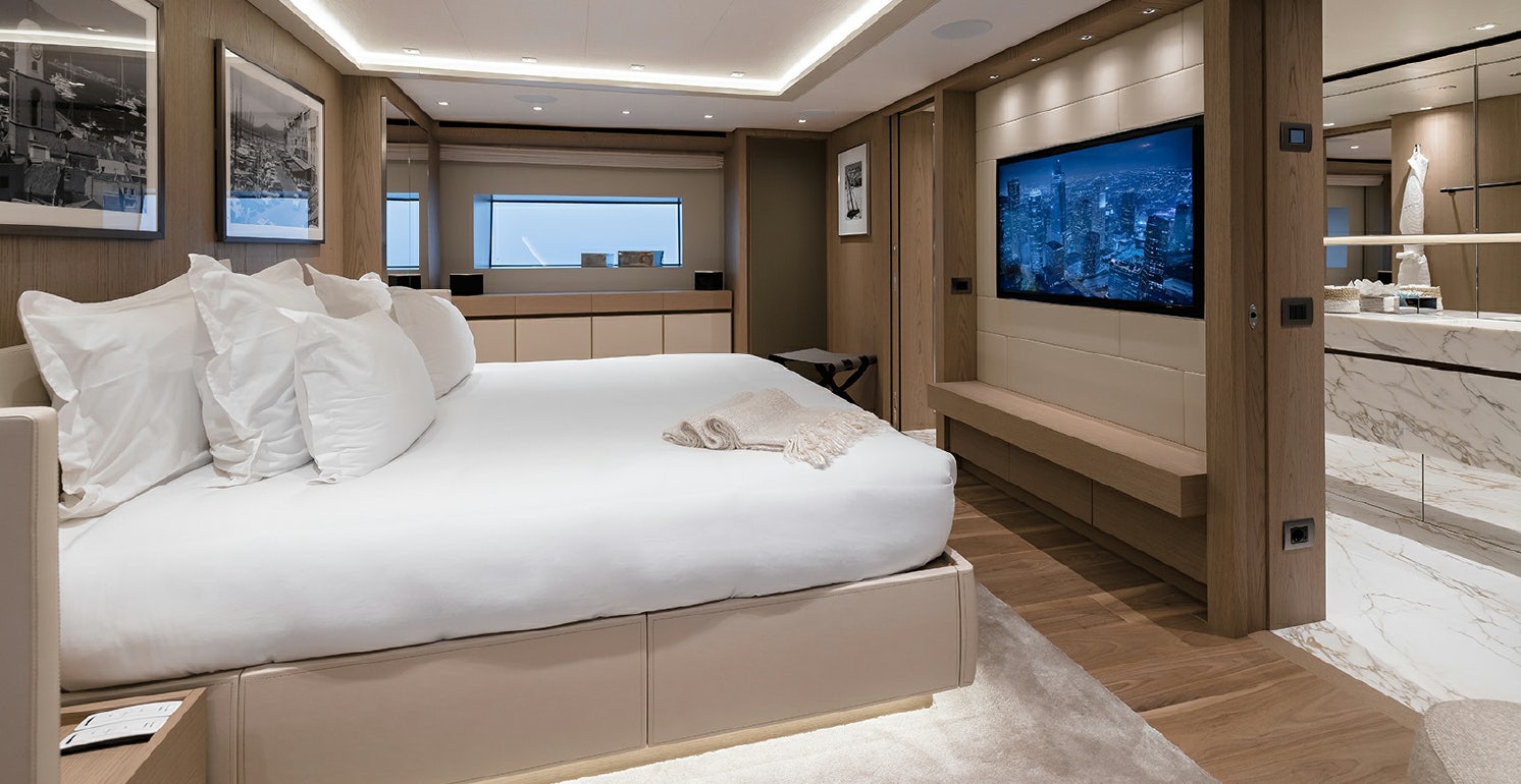 a bed in a room aboard LES BRUXELLOIS Yacht for Charter