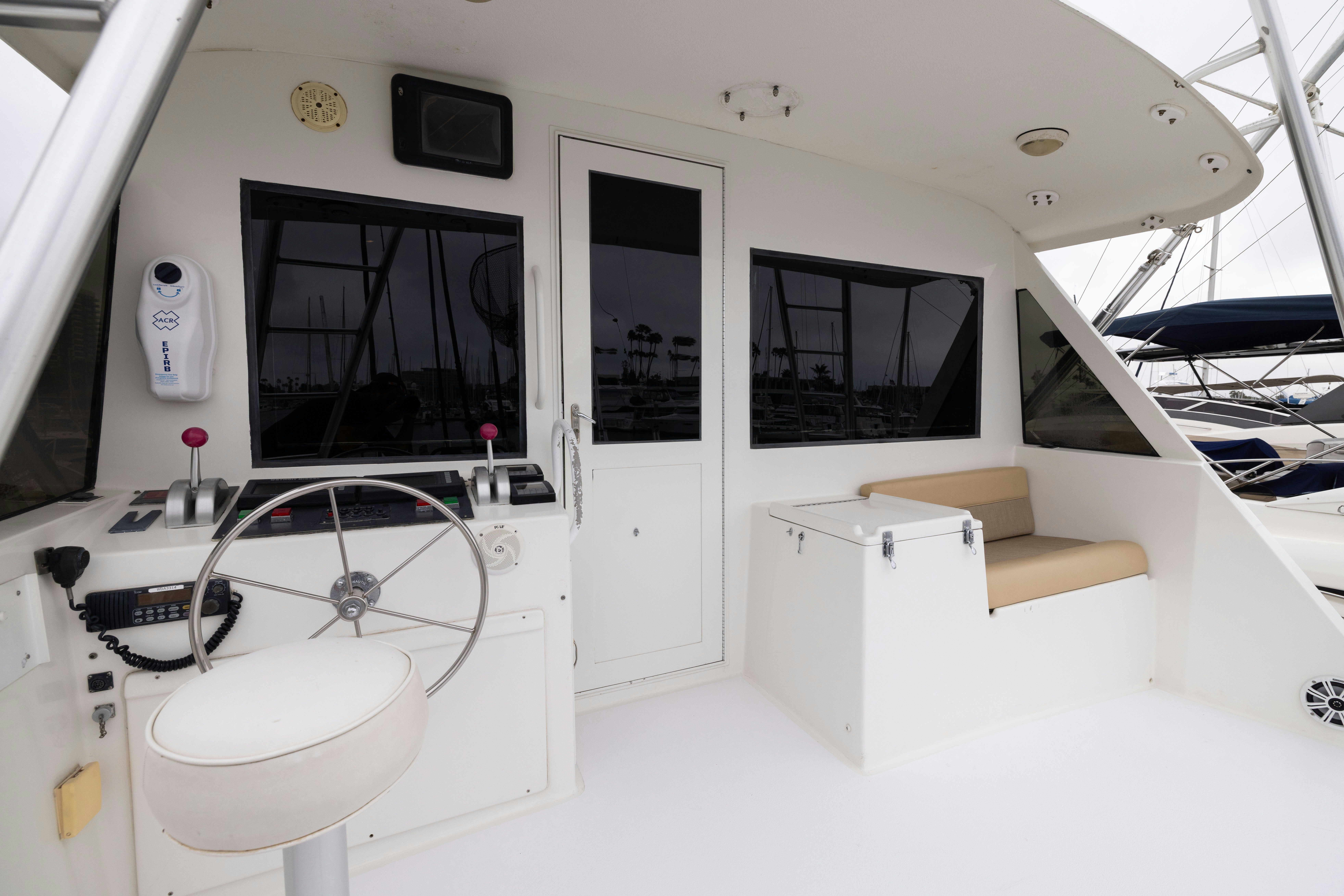a white room with a sink and a large window aboard PREMIUM Yacht for Sale
