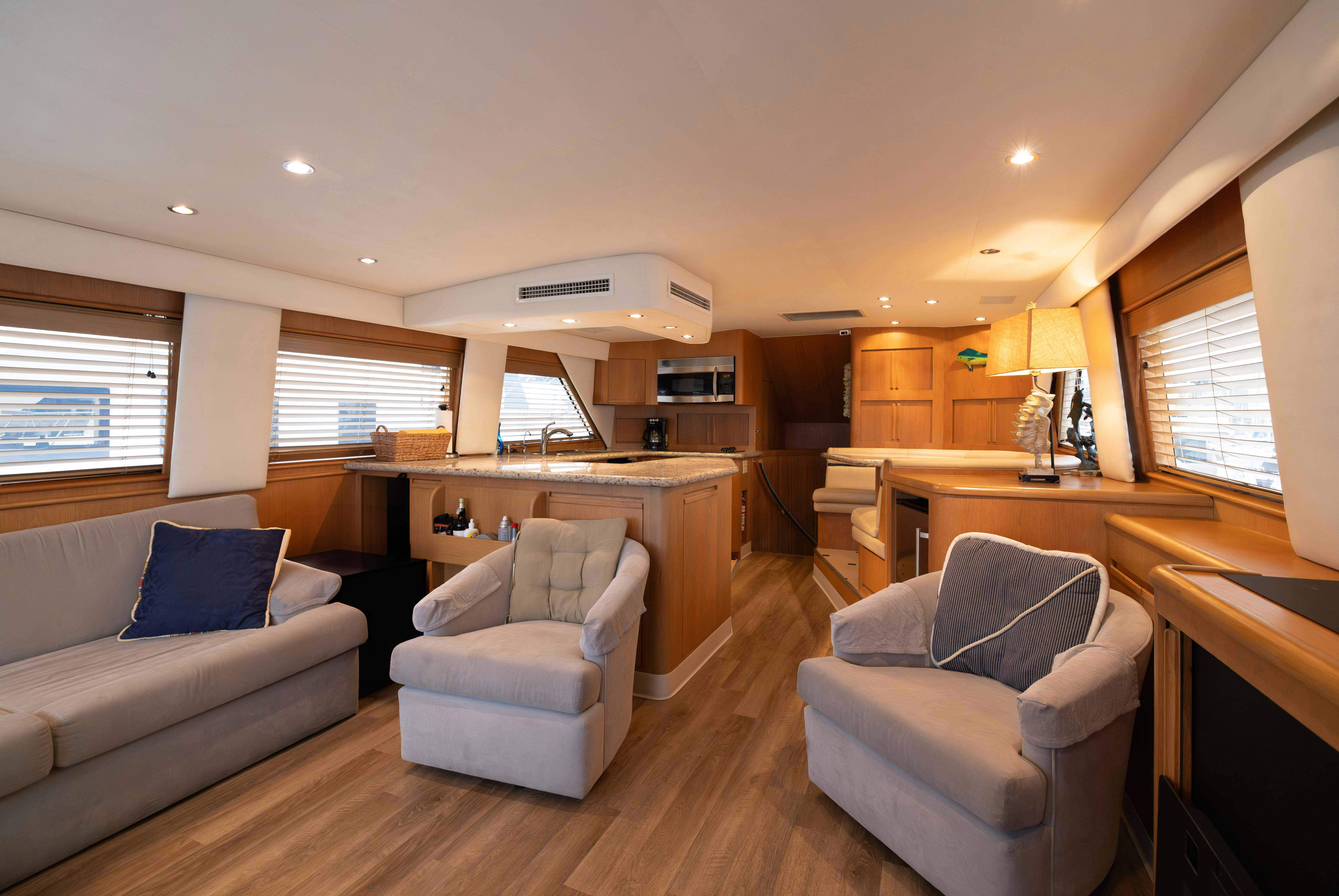 a living room with a couch and a table aboard PREMIUM Yacht for Sale