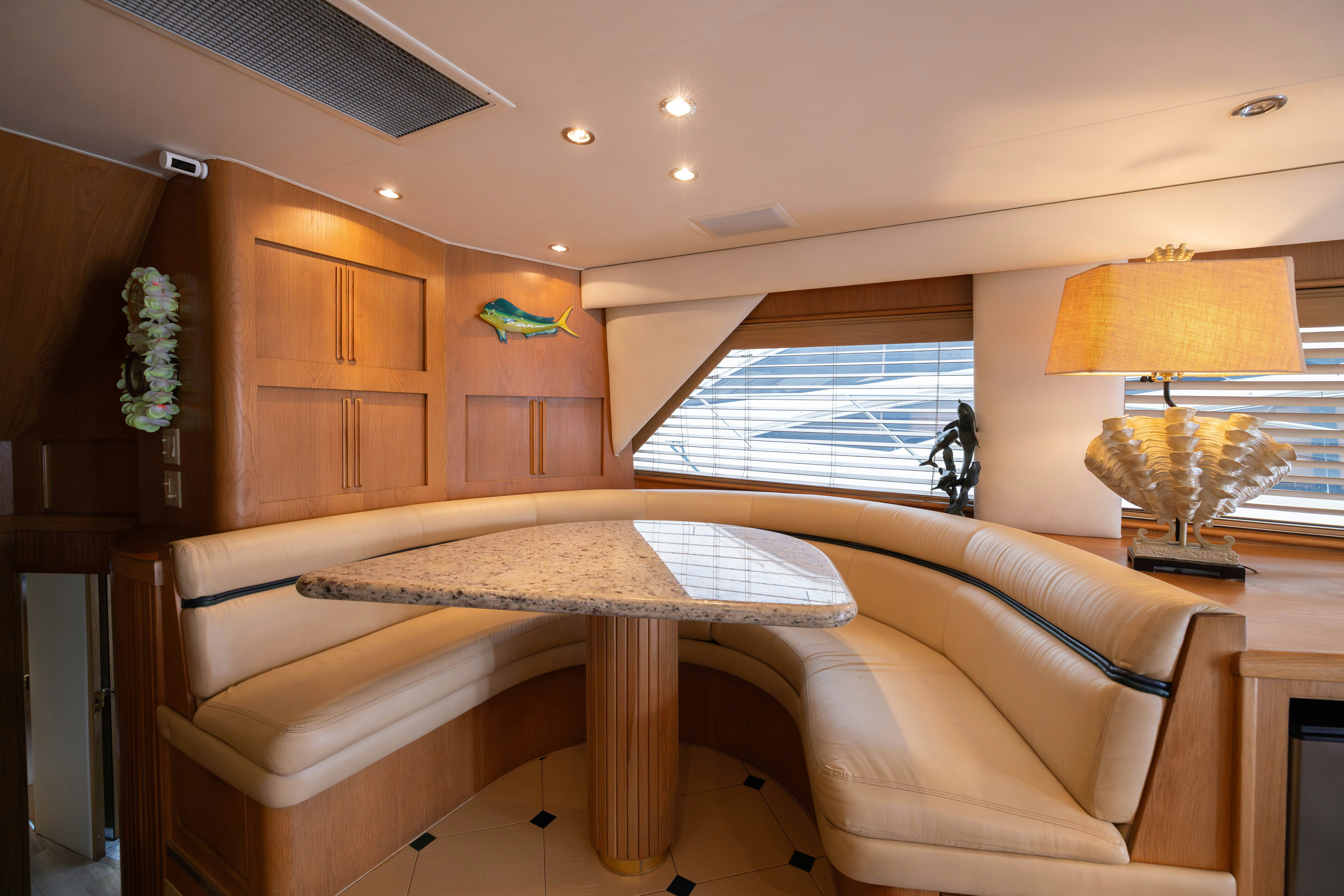 a living room with a couch and a lamp aboard PREMIUM Yacht for Sale