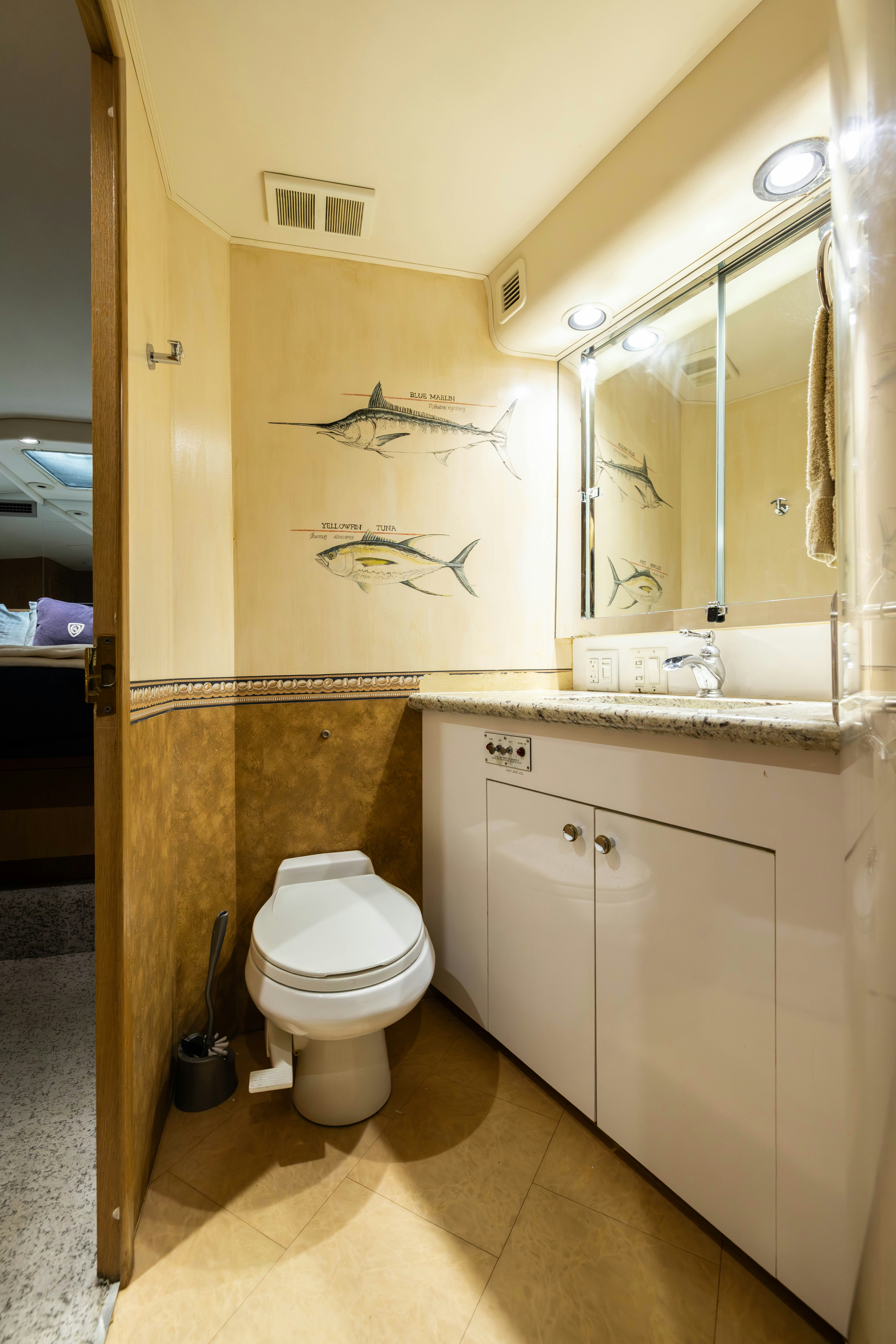 a bathroom with a toilet and a sink aboard PREMIUM Yacht for Sale