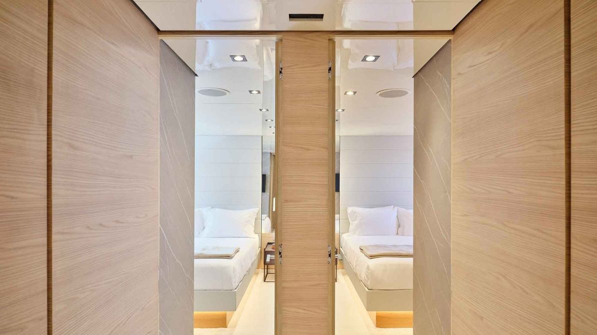 a closet with a bed and a sink aboard MAMMA MIA Yacht for Charter