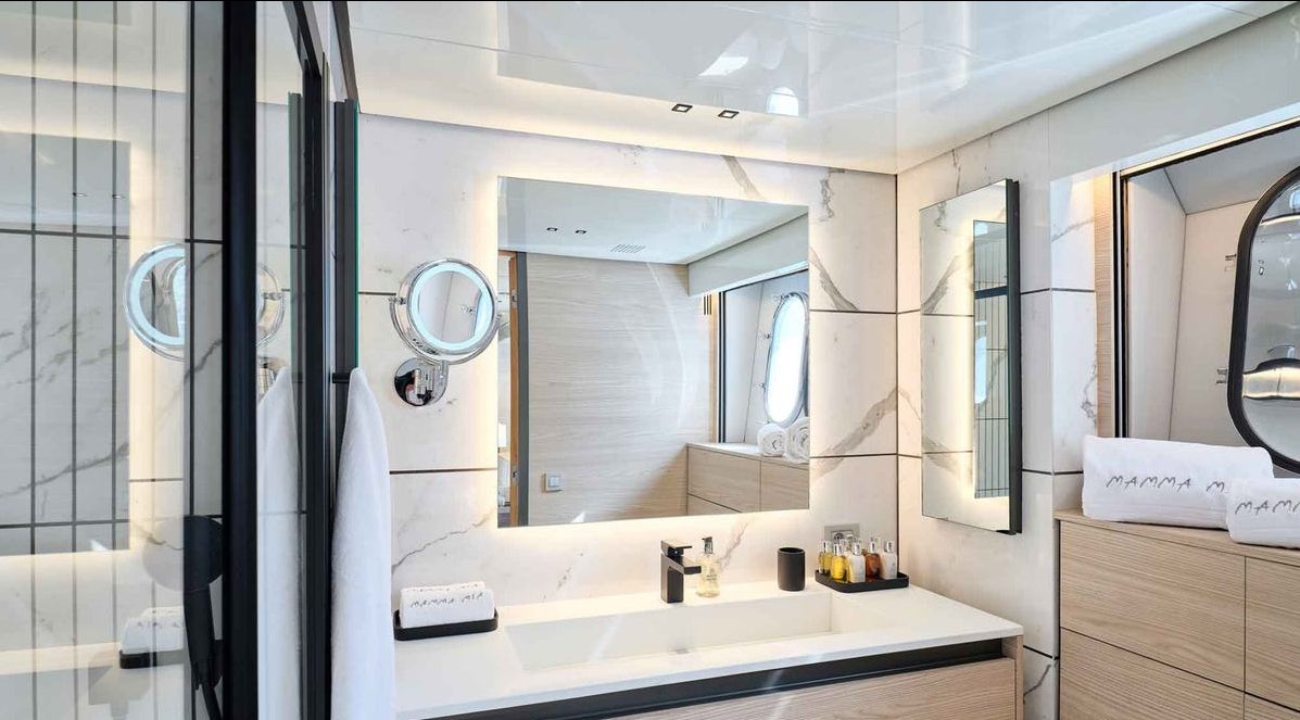 a bathroom with a large mirror aboard MAMMA MIA Yacht for Charter