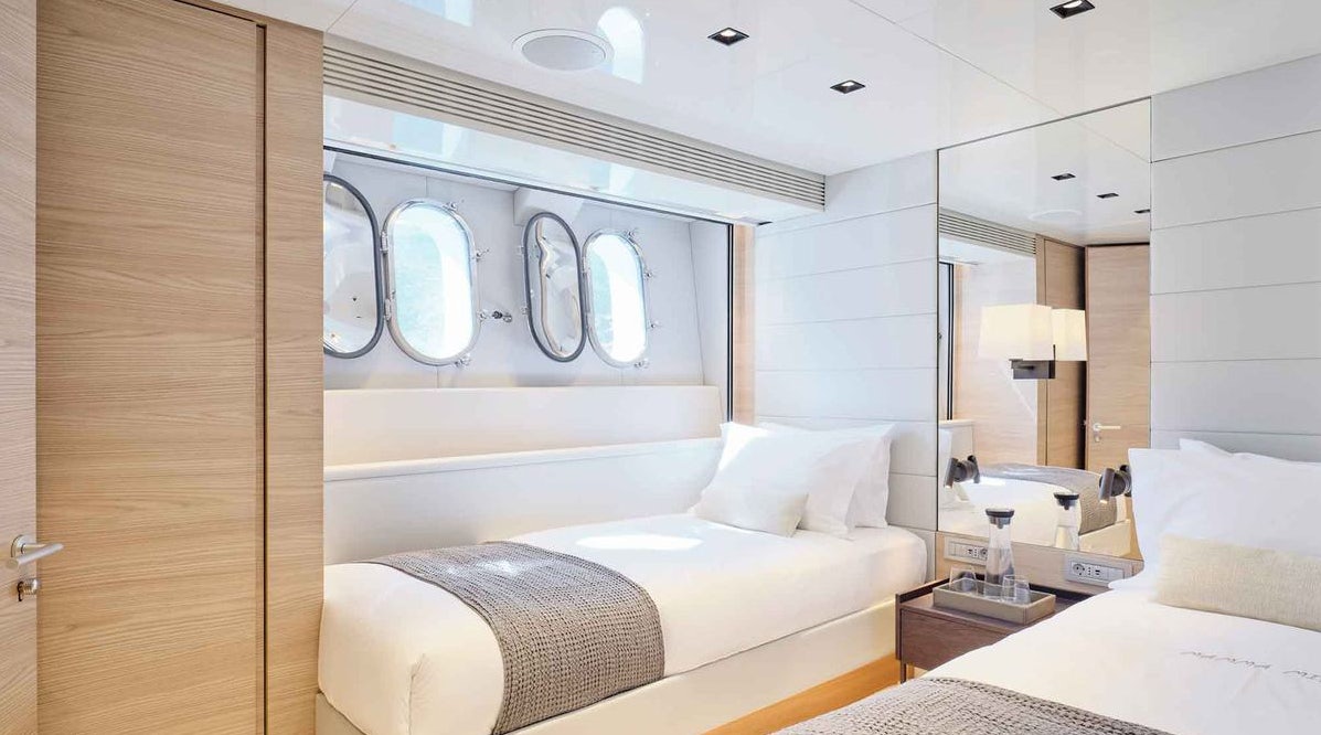 a room with a bed and a mirror aboard MAMMA MIA Yacht for Charter