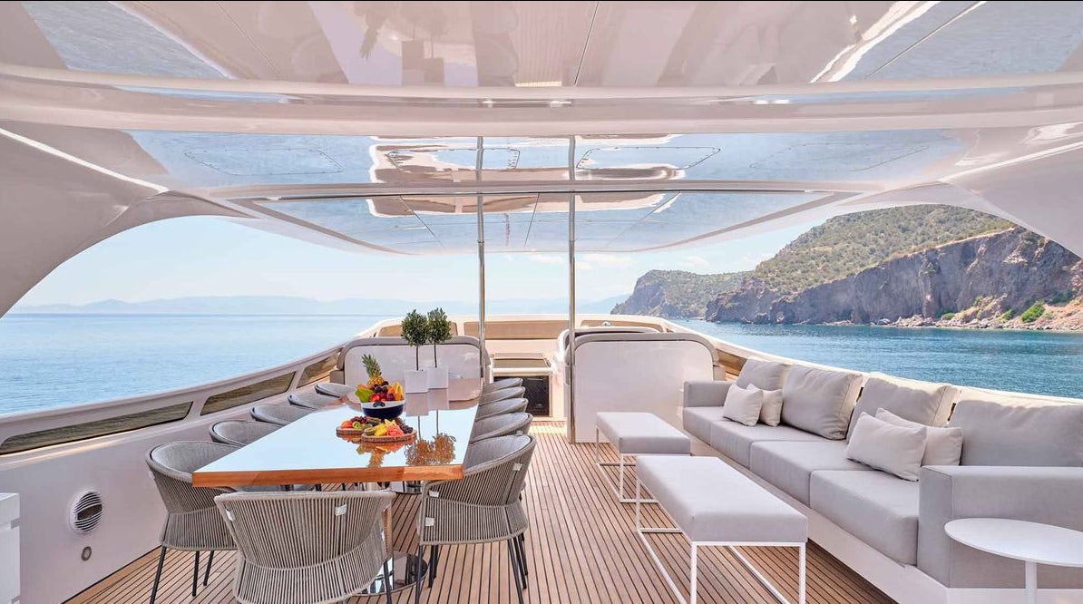 a room with a table and chairs on a boat aboard MAMMA MIA Yacht for Charter