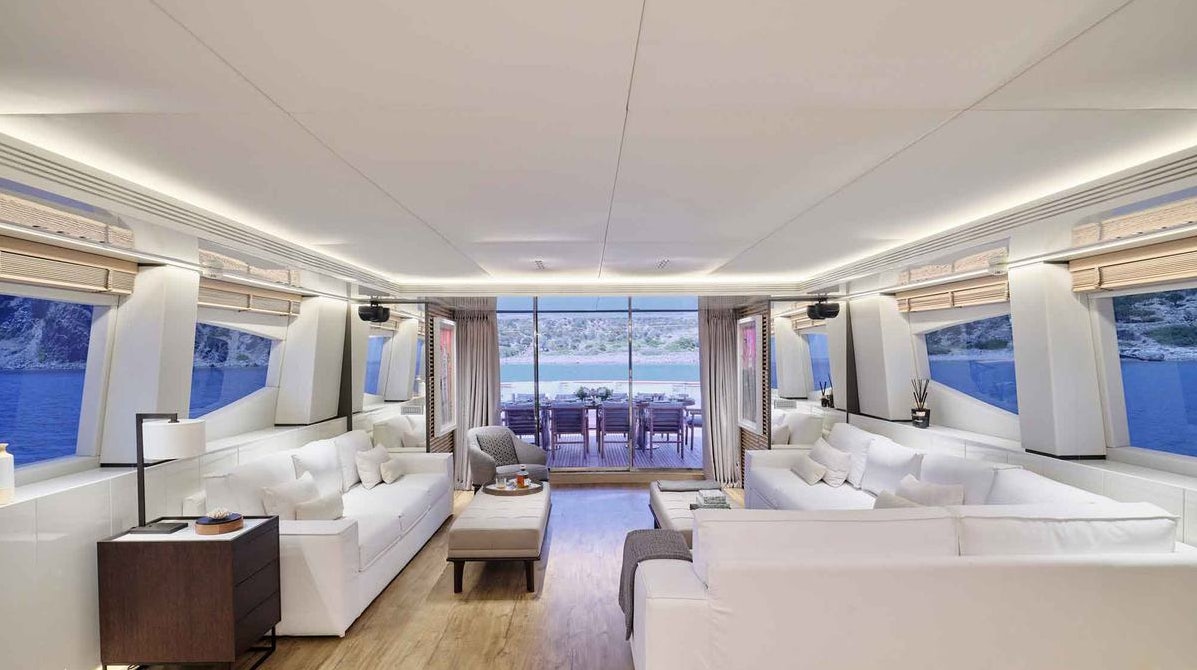 a room with a bed and a desk aboard MAMMA MIA Yacht for Charter
