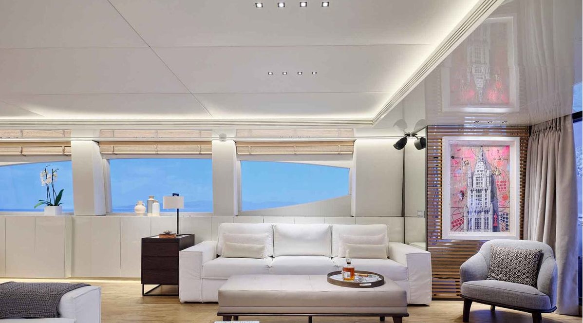 a living room with a large window aboard MAMMA MIA Yacht for Charter