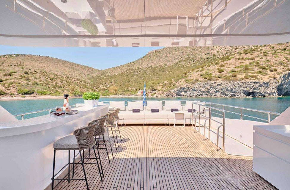 a deck with a pool and a person on it aboard MAMMA MIA Yacht for Charter