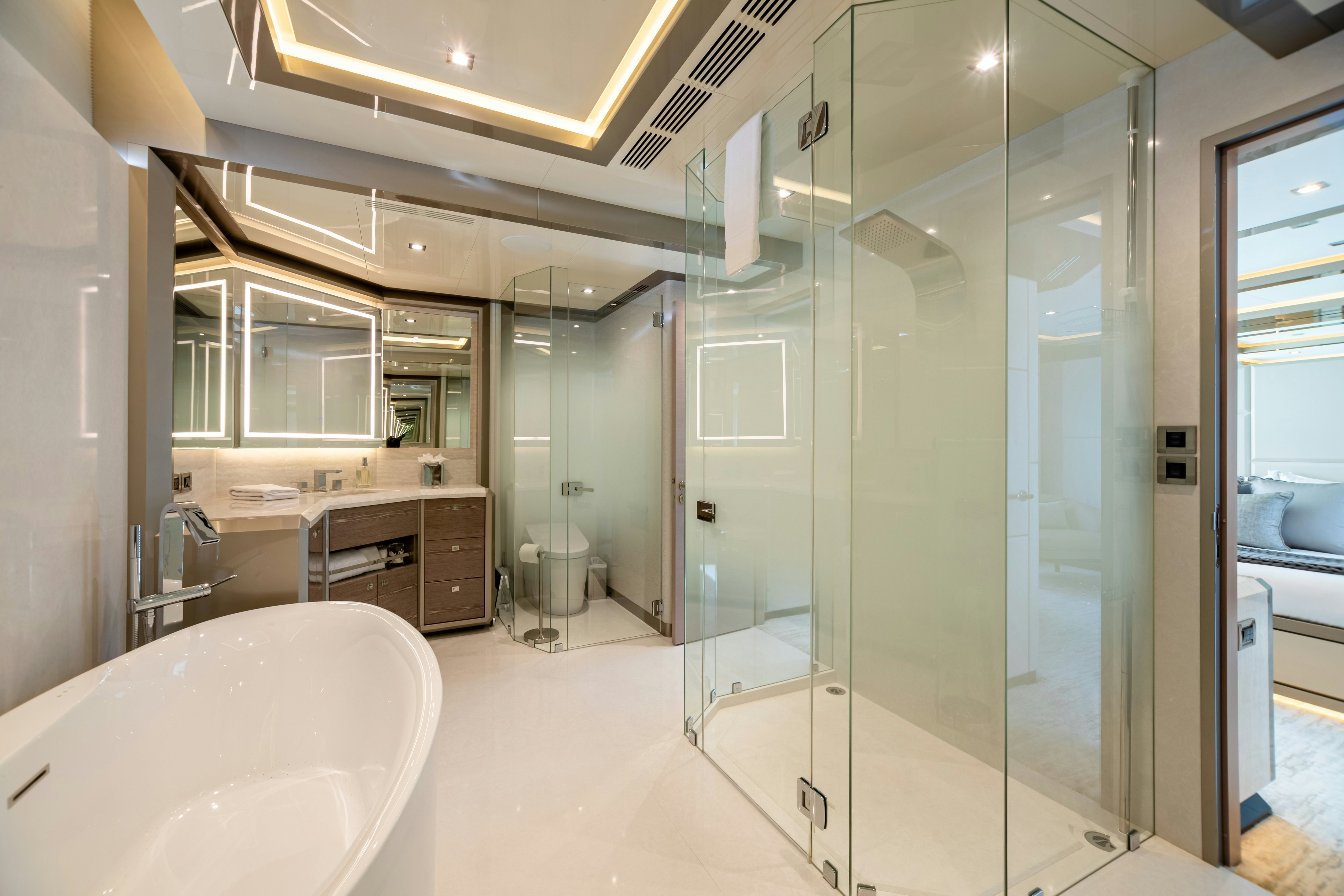 a bathroom with a glass shower aboard BOA VIDA Yacht for Charter