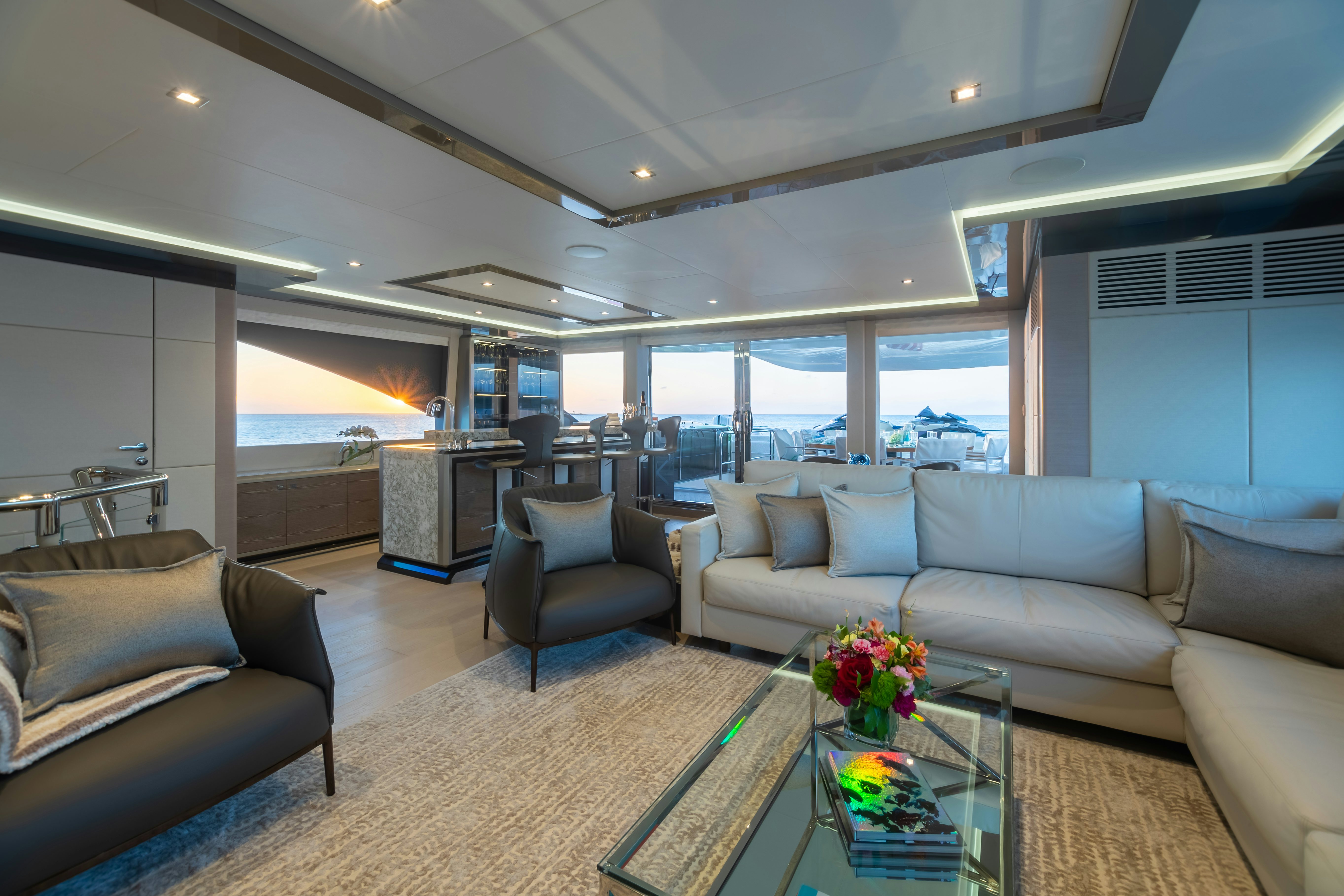 a living room with a large window aboard BOA VIDA Yacht for Charter