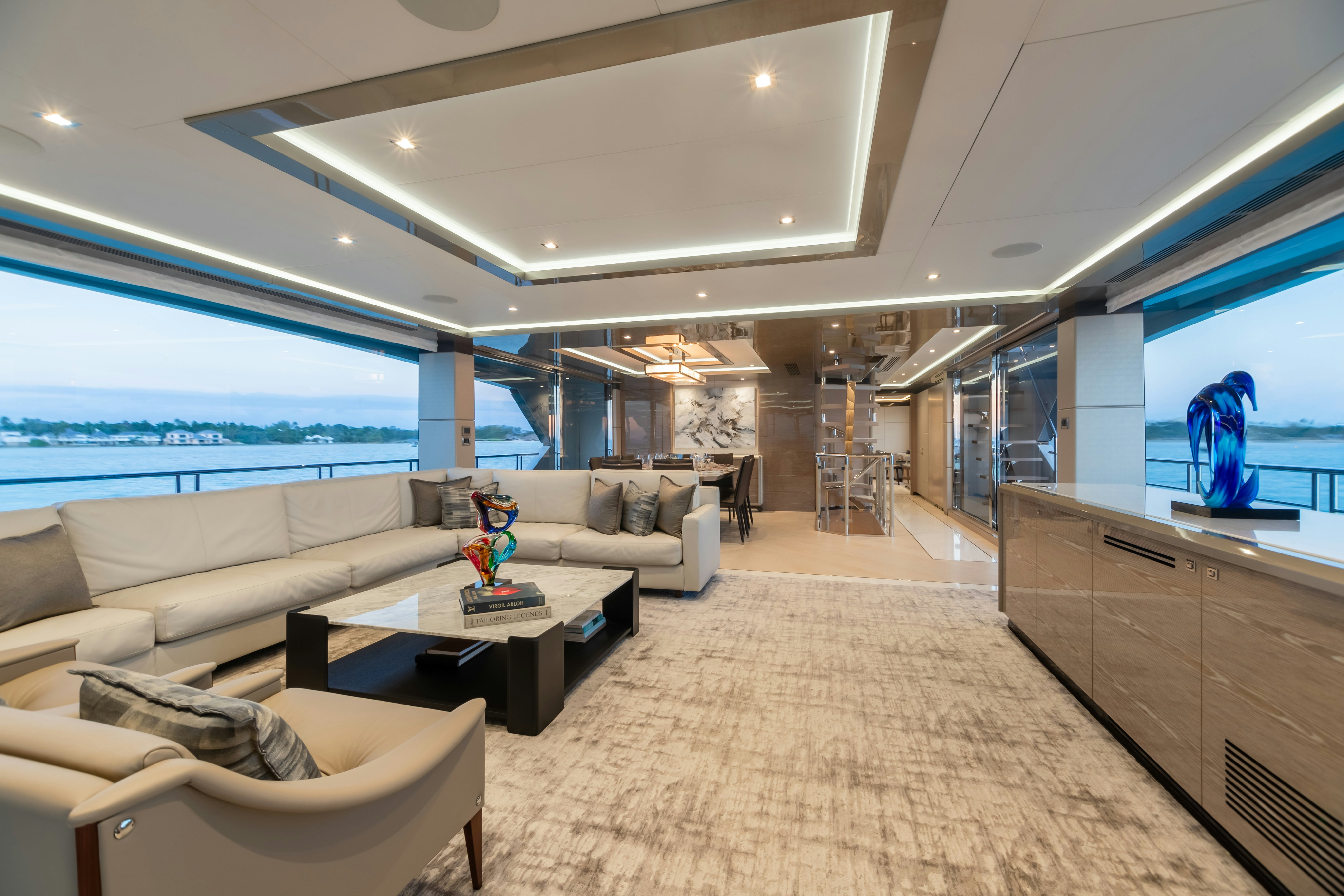 a living room with a large window aboard BOA VIDA Yacht for Charter