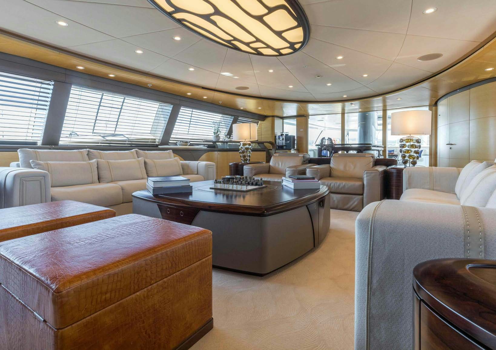 a large living room with a large window aboard SALVAJE Yacht for Sale