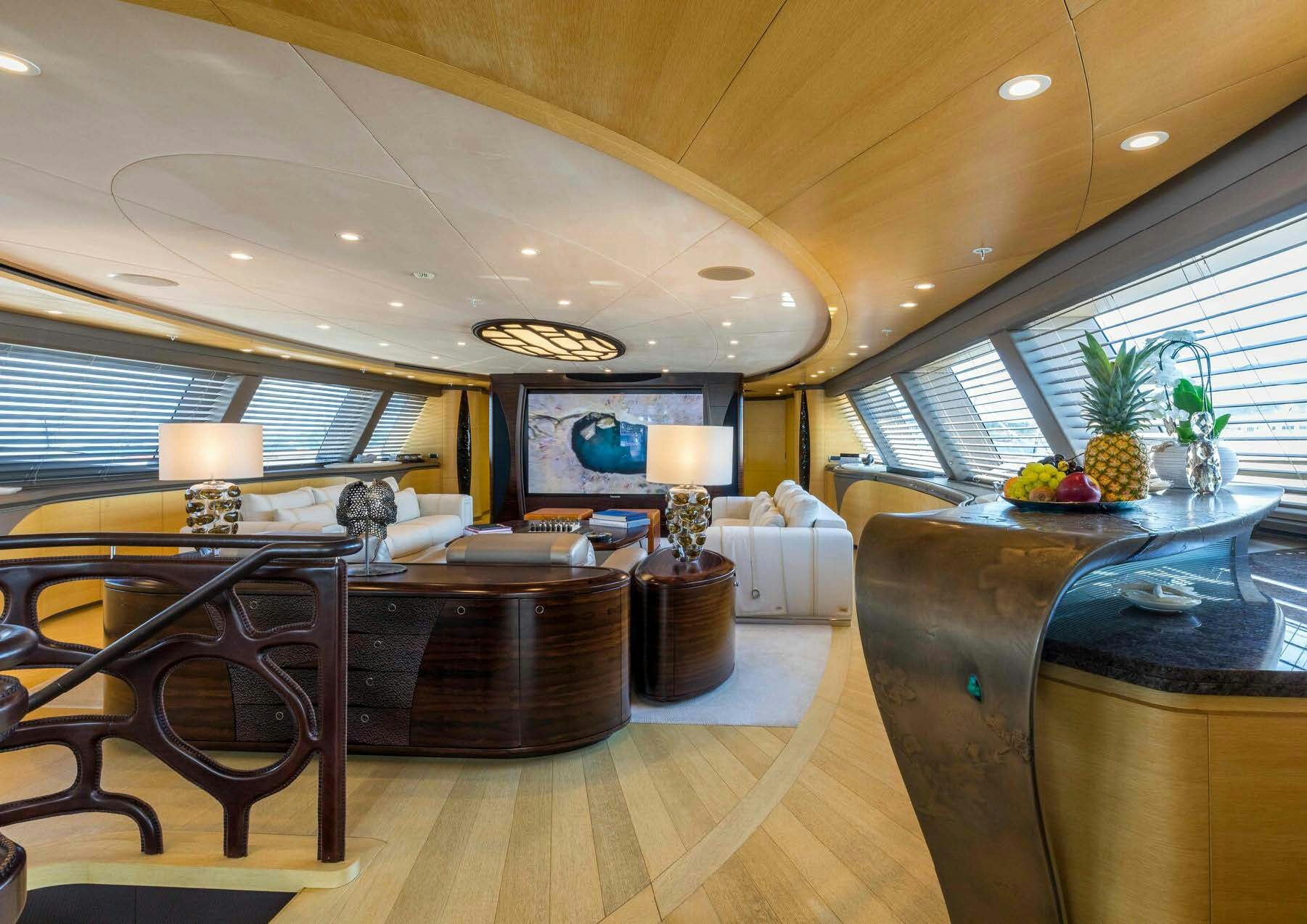 a large living room with a piano aboard SALVAJE Yacht for Sale