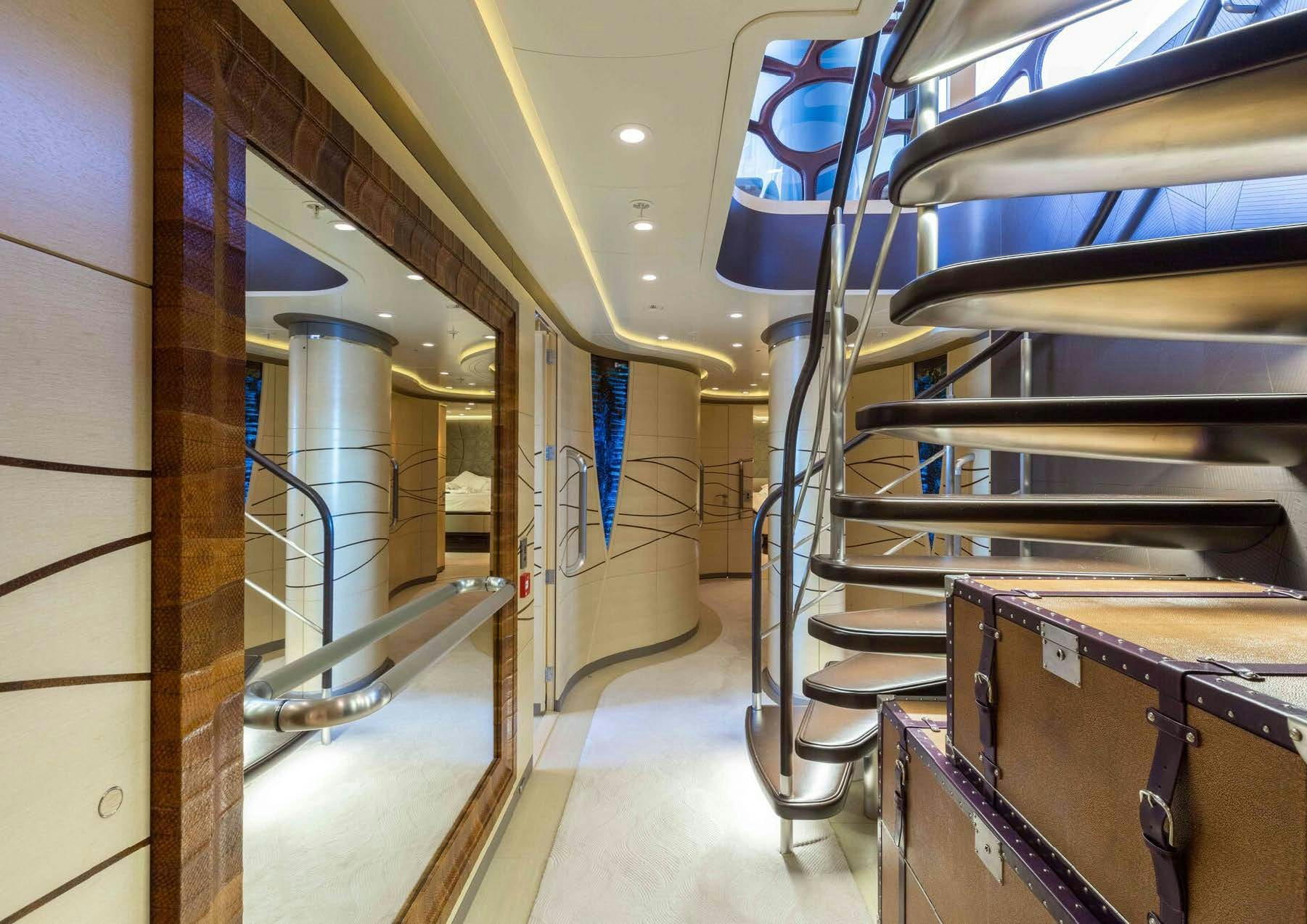 a room with metal stairs and metal railings aboard SALVAJE Yacht for Sale