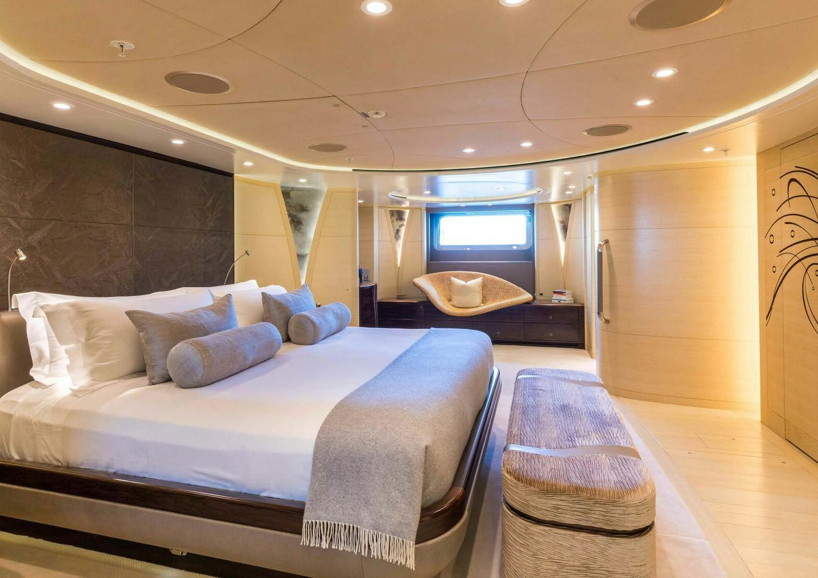 a bed in a room aboard SALVAJE Yacht for Sale