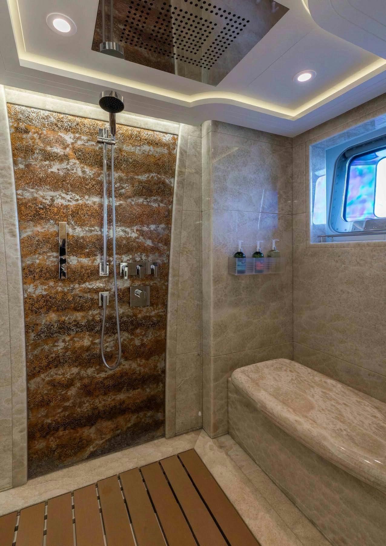 a bathroom with a shower aboard SALVAJE Yacht for Sale