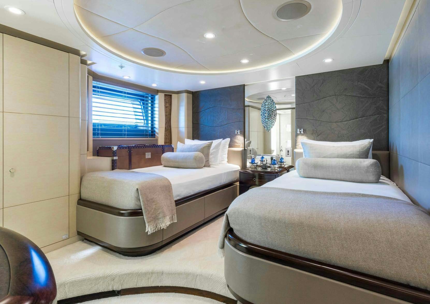 a room with two beds aboard SALVAJE Yacht for Sale
