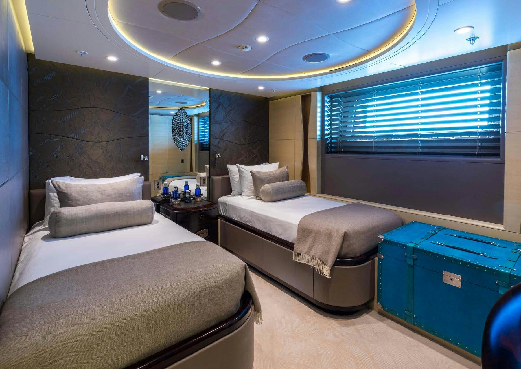 a room with two beds aboard SALVAJE Yacht for Sale