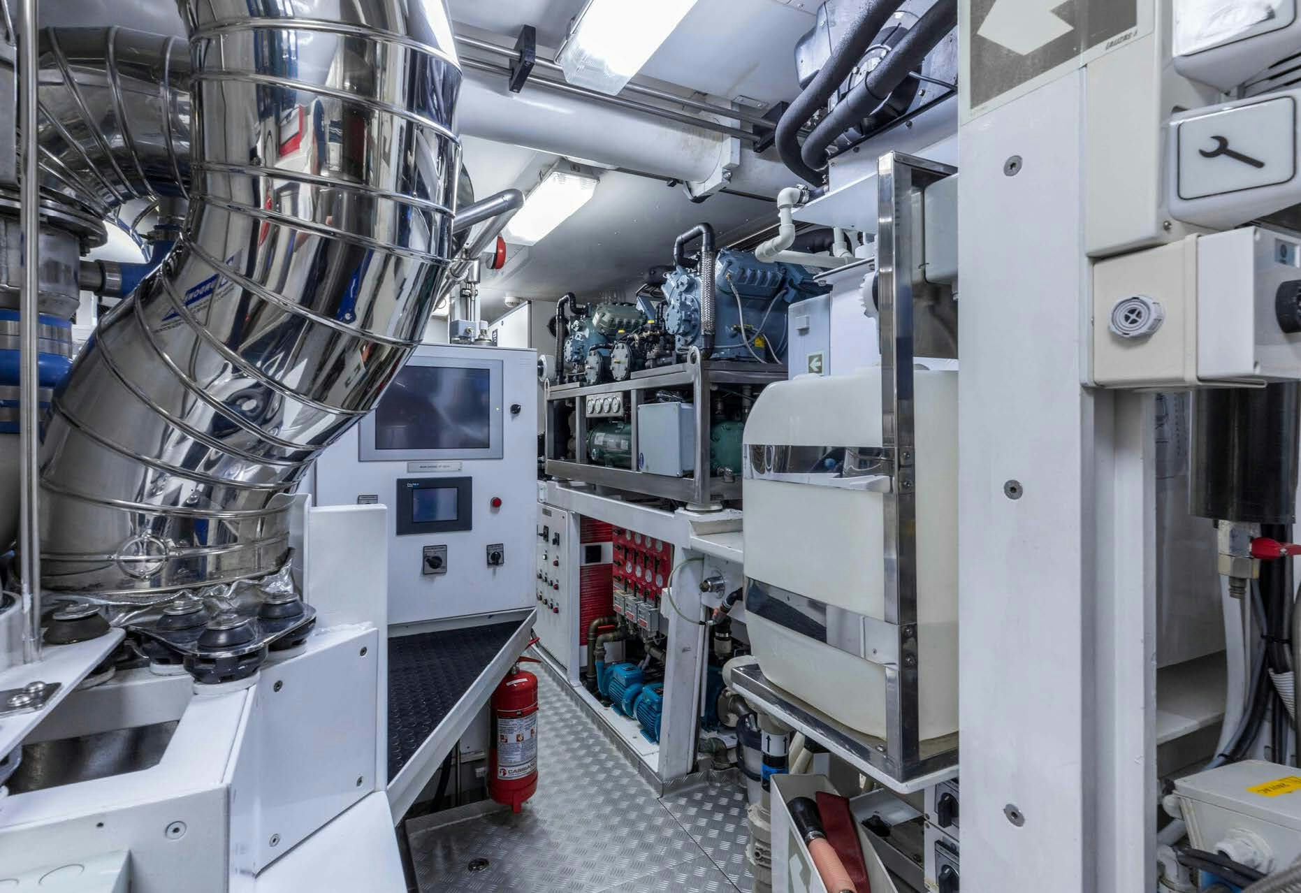 a room with white machines aboard SALVAJE Yacht for Sale