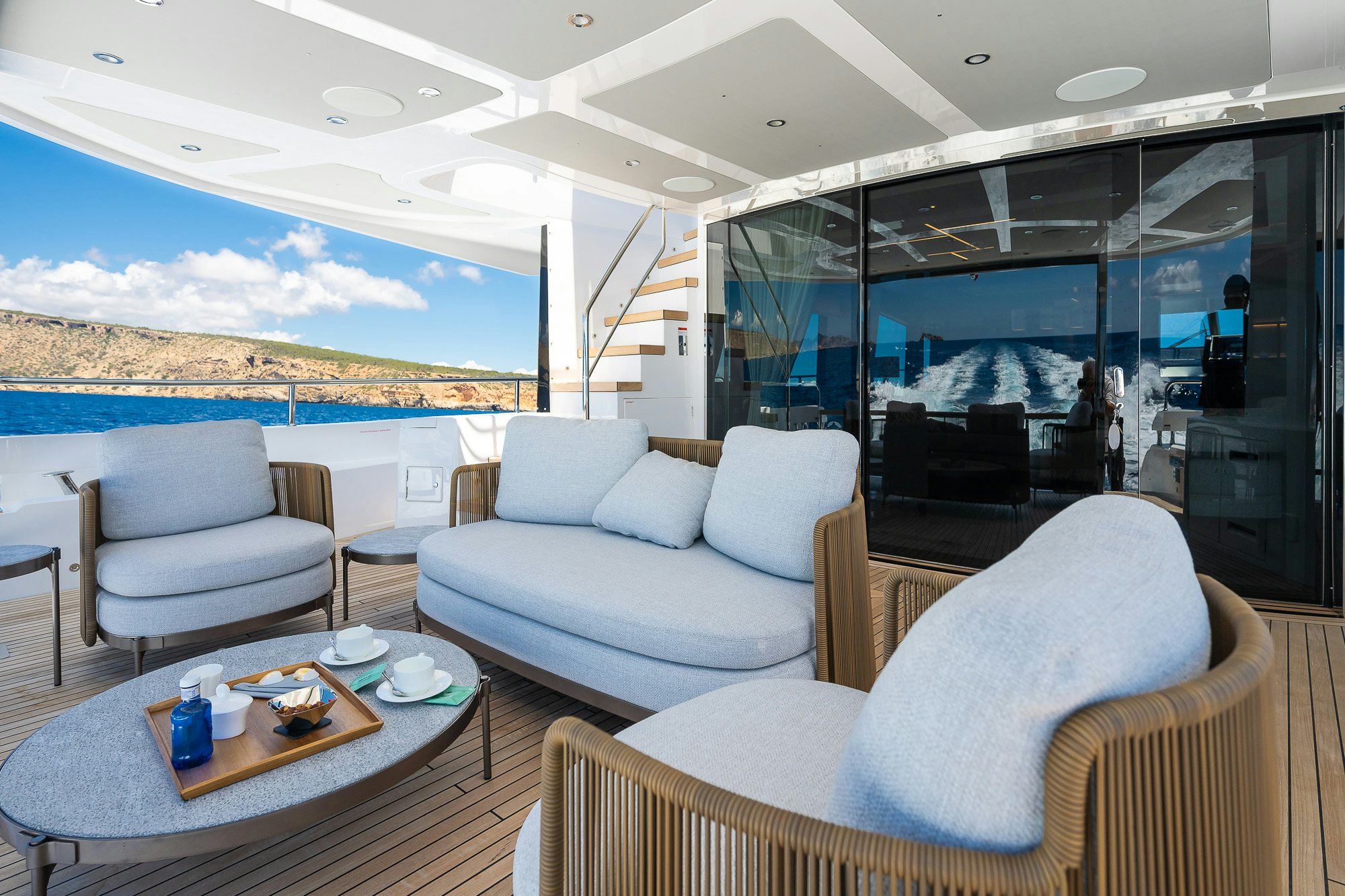 a living room with a large glass window aboard CELESTE NOREEN Yacht for Sale