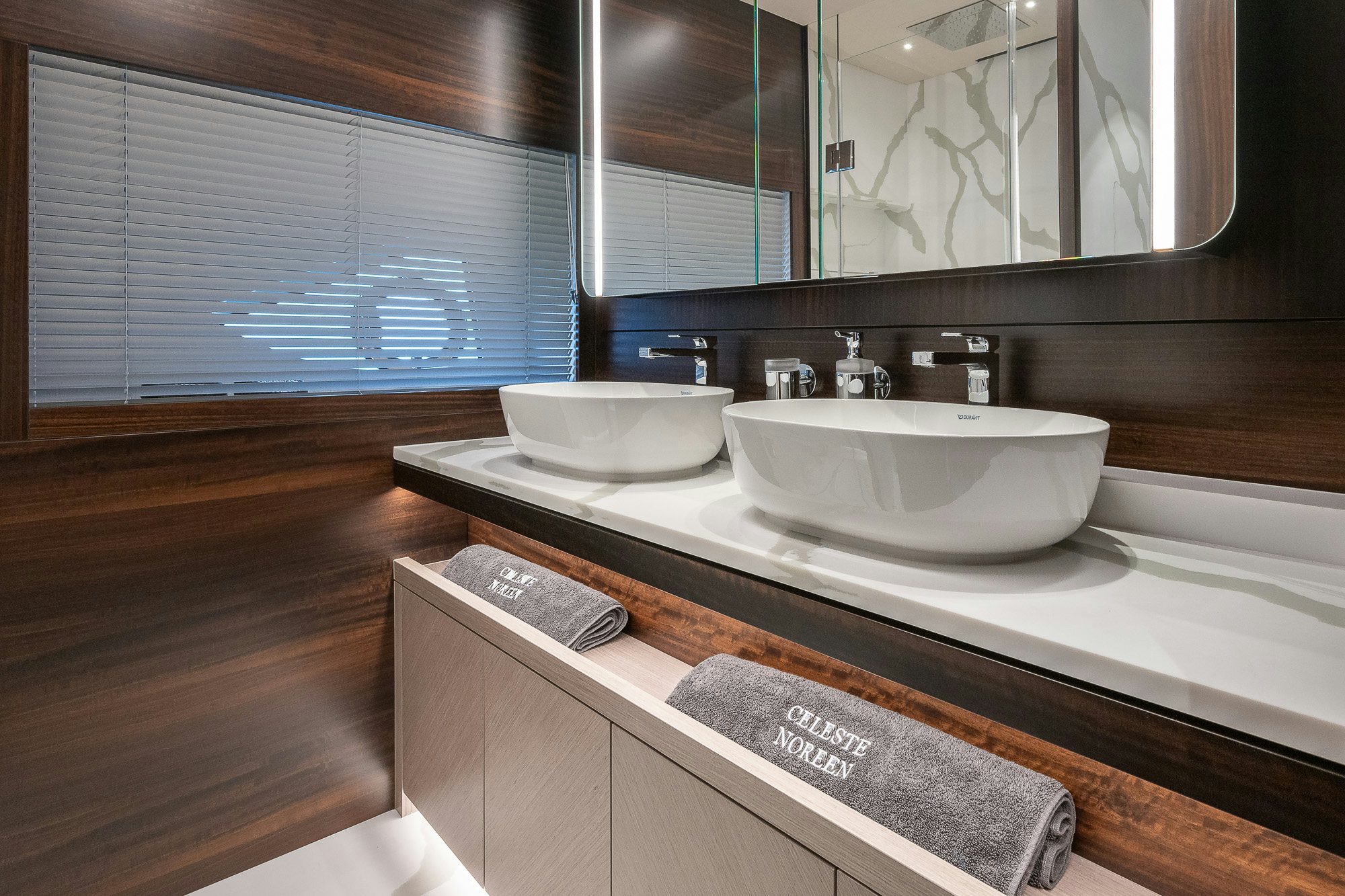 a bathroom with a sink and a mirror aboard CELESTE NOREEN Yacht for Sale