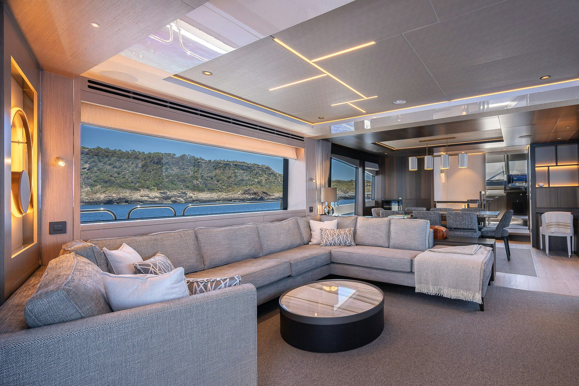 a living room with a large window aboard CELESTE NOREEN Yacht for Sale