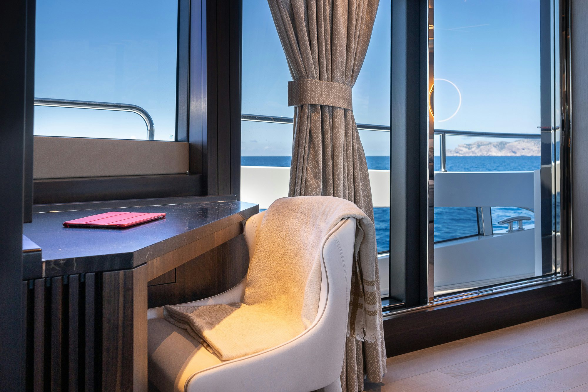 a room with a table and a window aboard CELESTE NOREEN Yacht for Sale