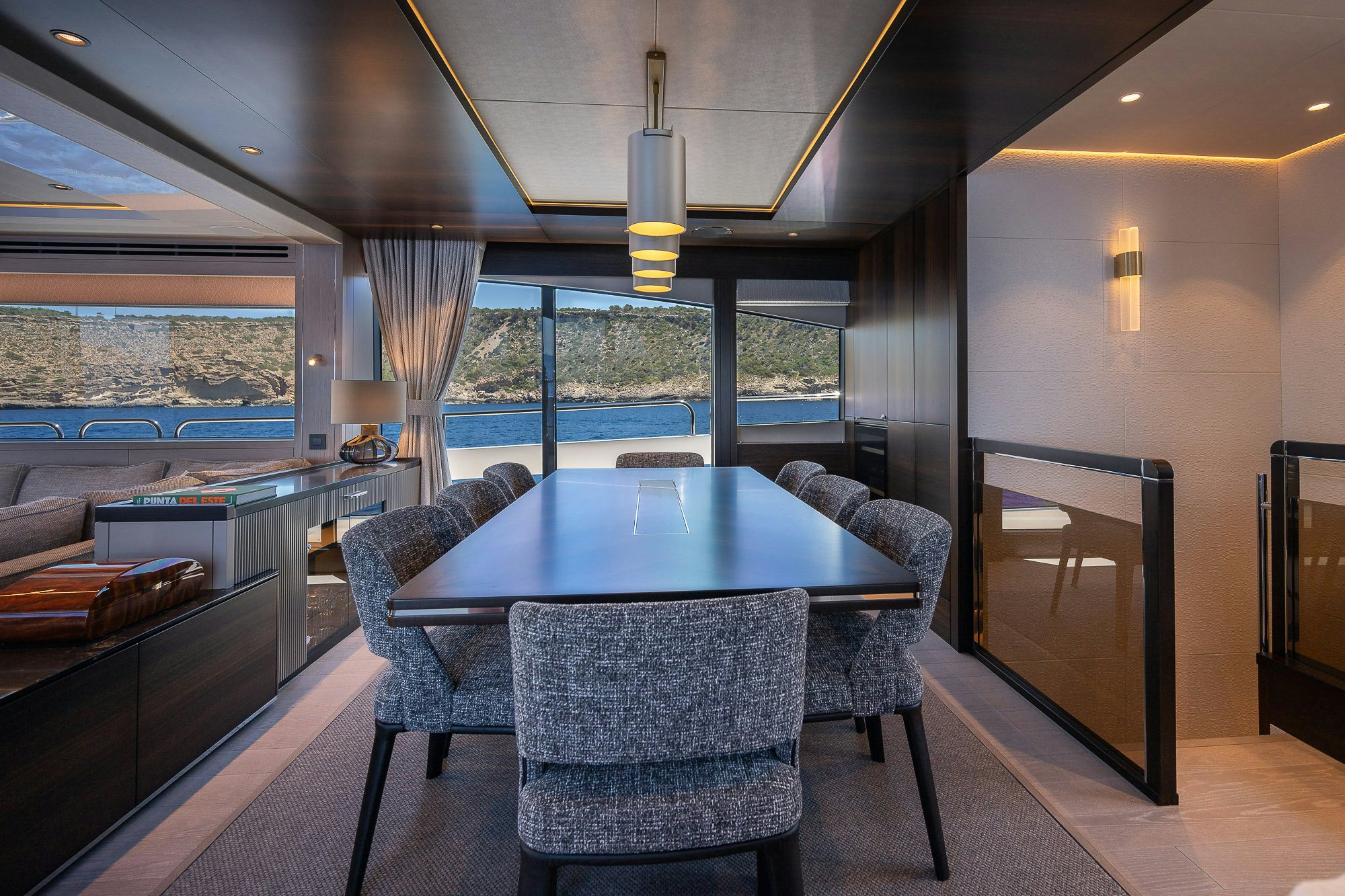 a room with a table and chairs aboard CELESTE NOREEN Yacht for Sale