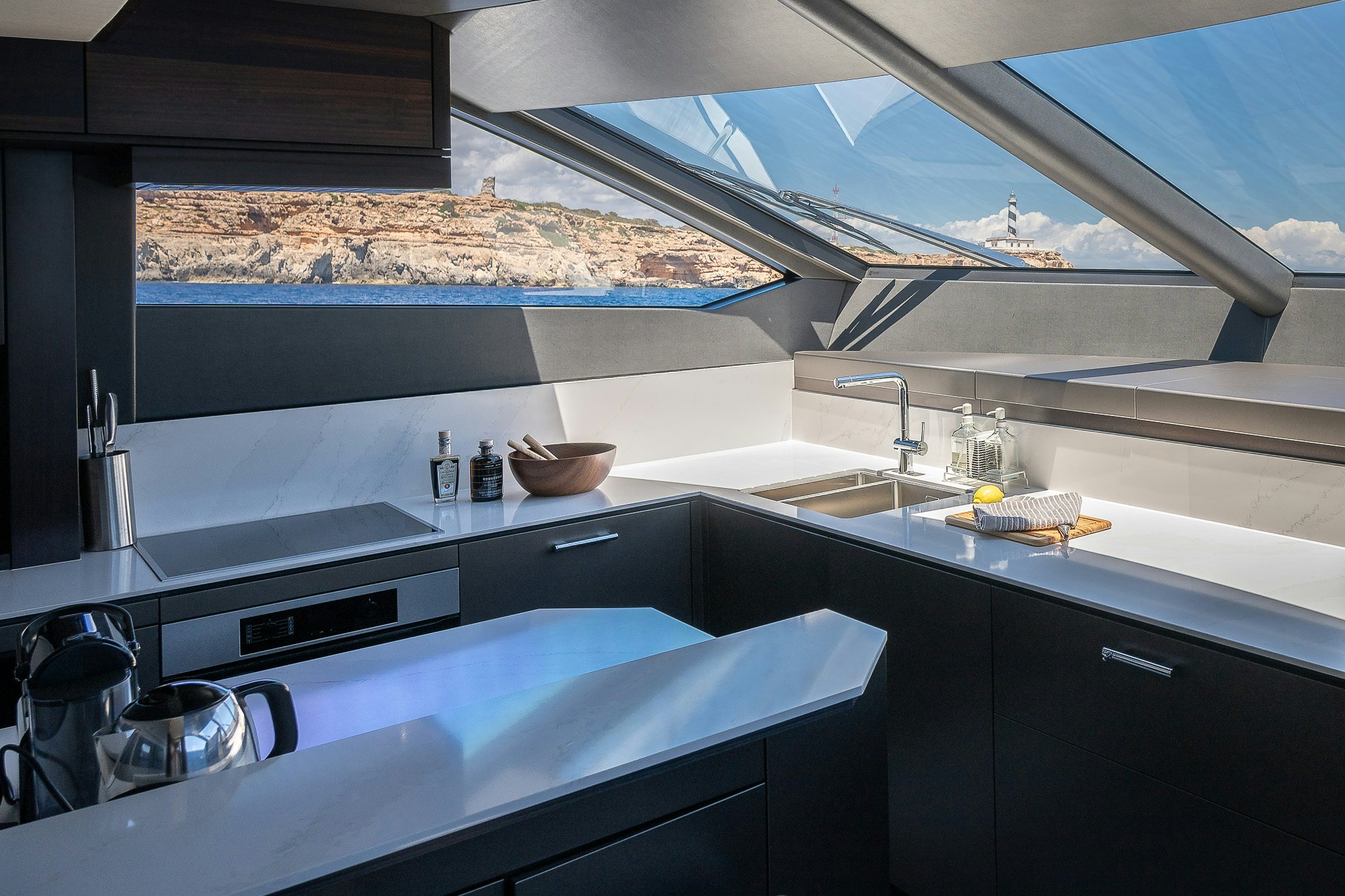 a kitchen with a large stone chimney aboard CELESTE NOREEN Yacht for Sale