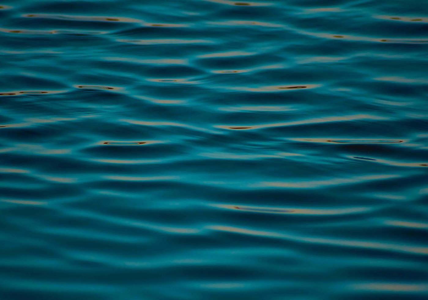 a body of water with a large body of water in the background aboard M Yacht for Charter