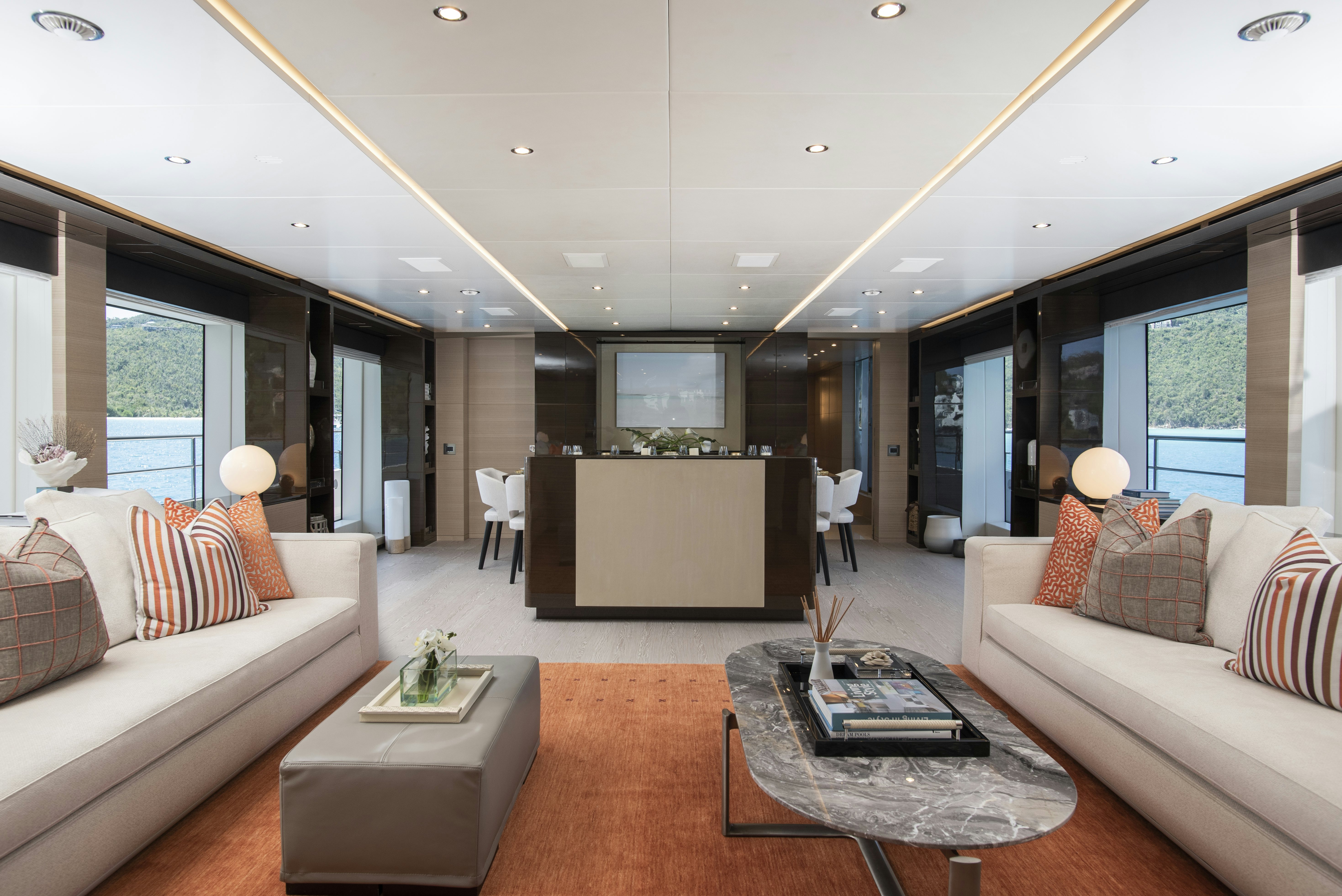 a living room with a large screen aboard WABASH Yacht for Sale