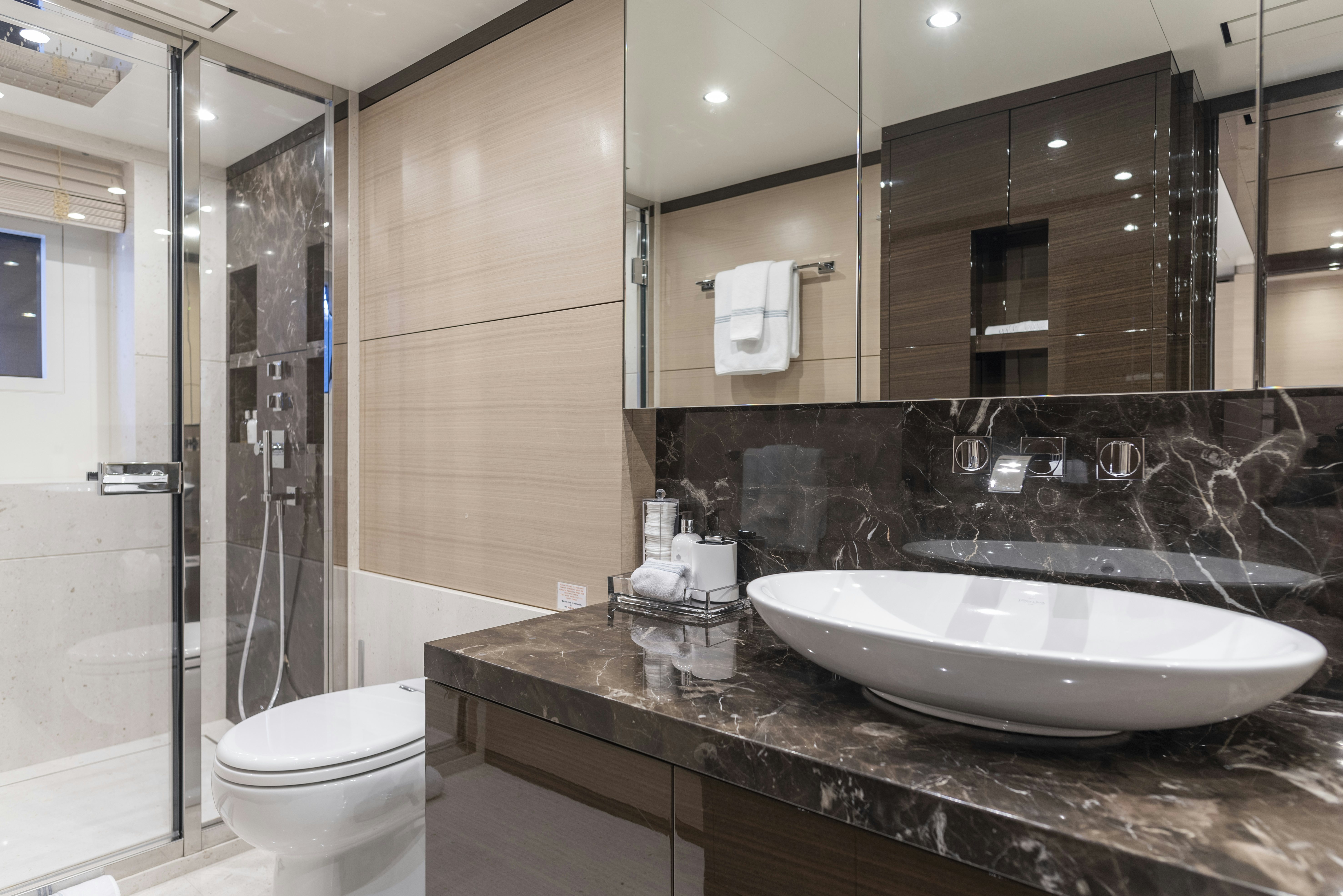 a bathroom with a sink and a toilet aboard WABASH Yacht for Sale