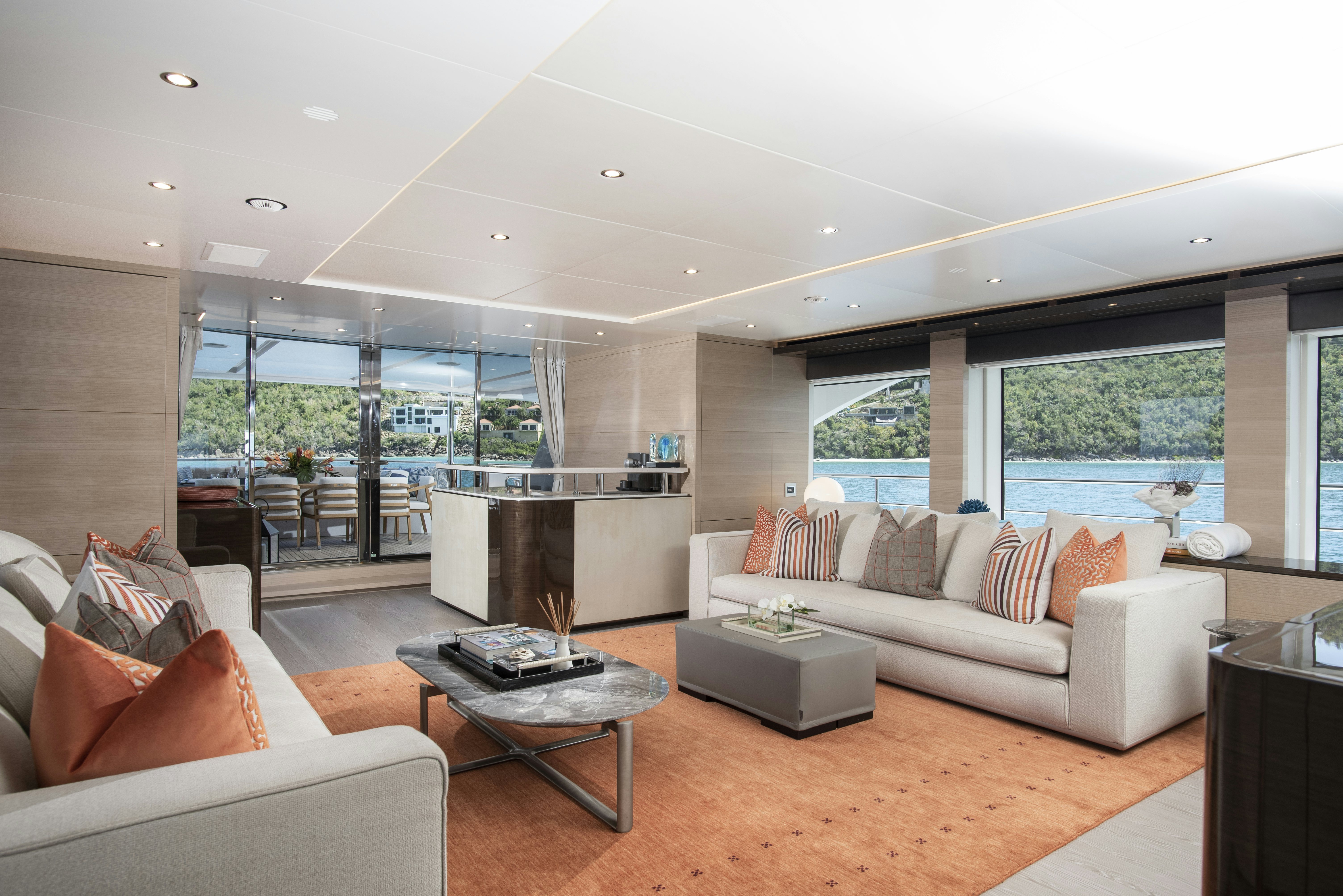 a living room with a fireplace aboard WABASH Yacht for Sale