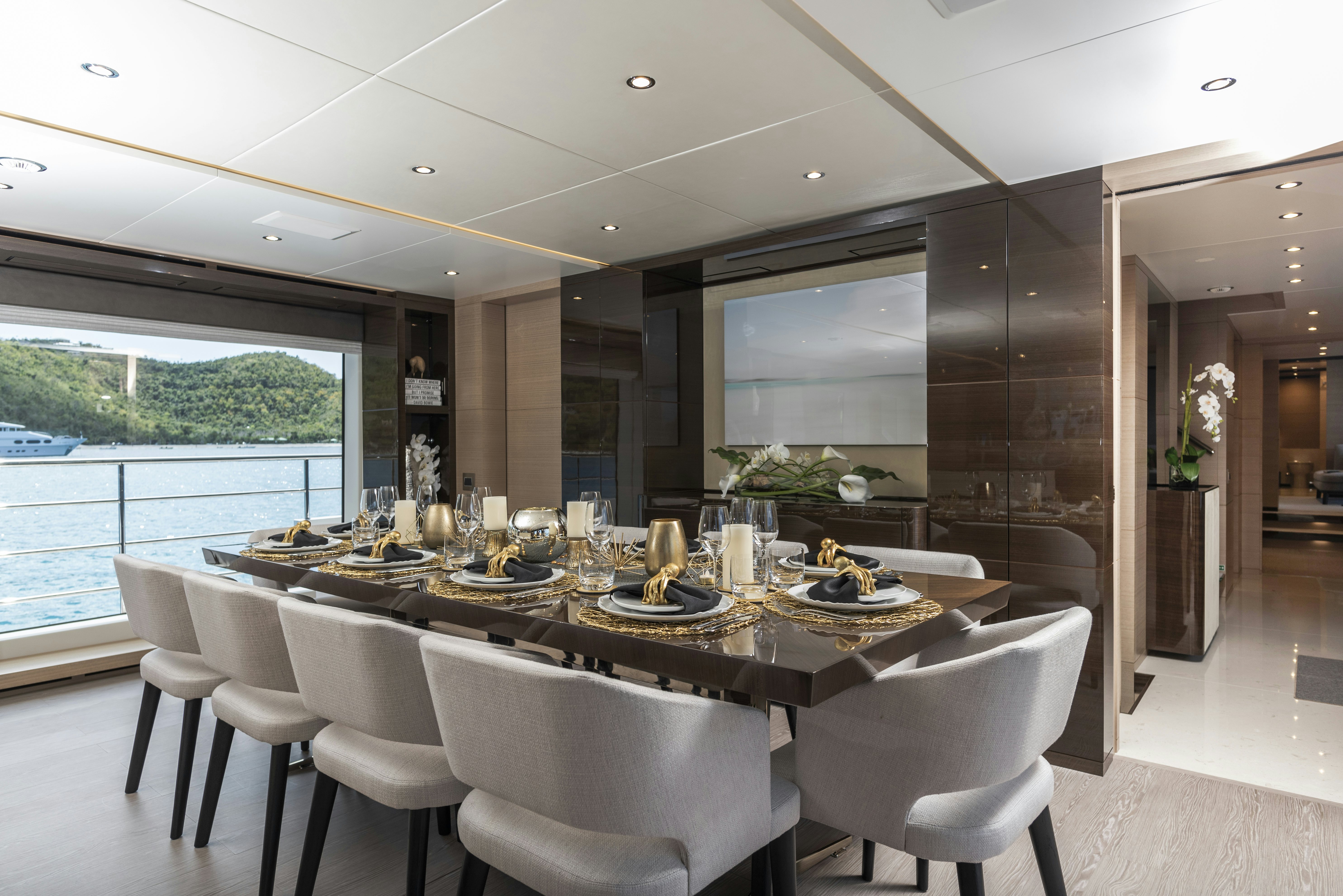 a dining table in a room aboard WABASH Yacht for Sale