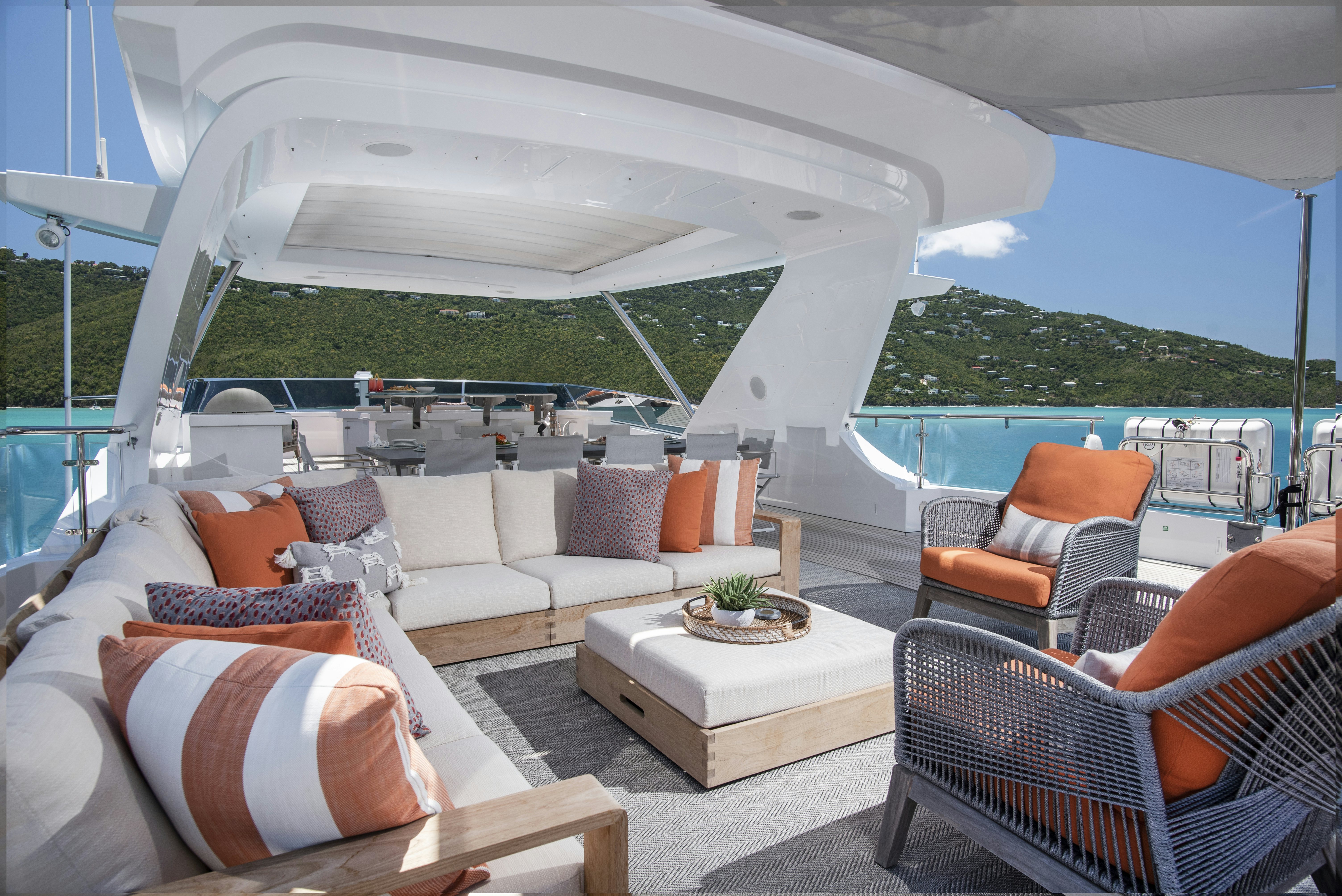 a large white tent with a couch and chairs around it aboard WABASH Yacht for Sale