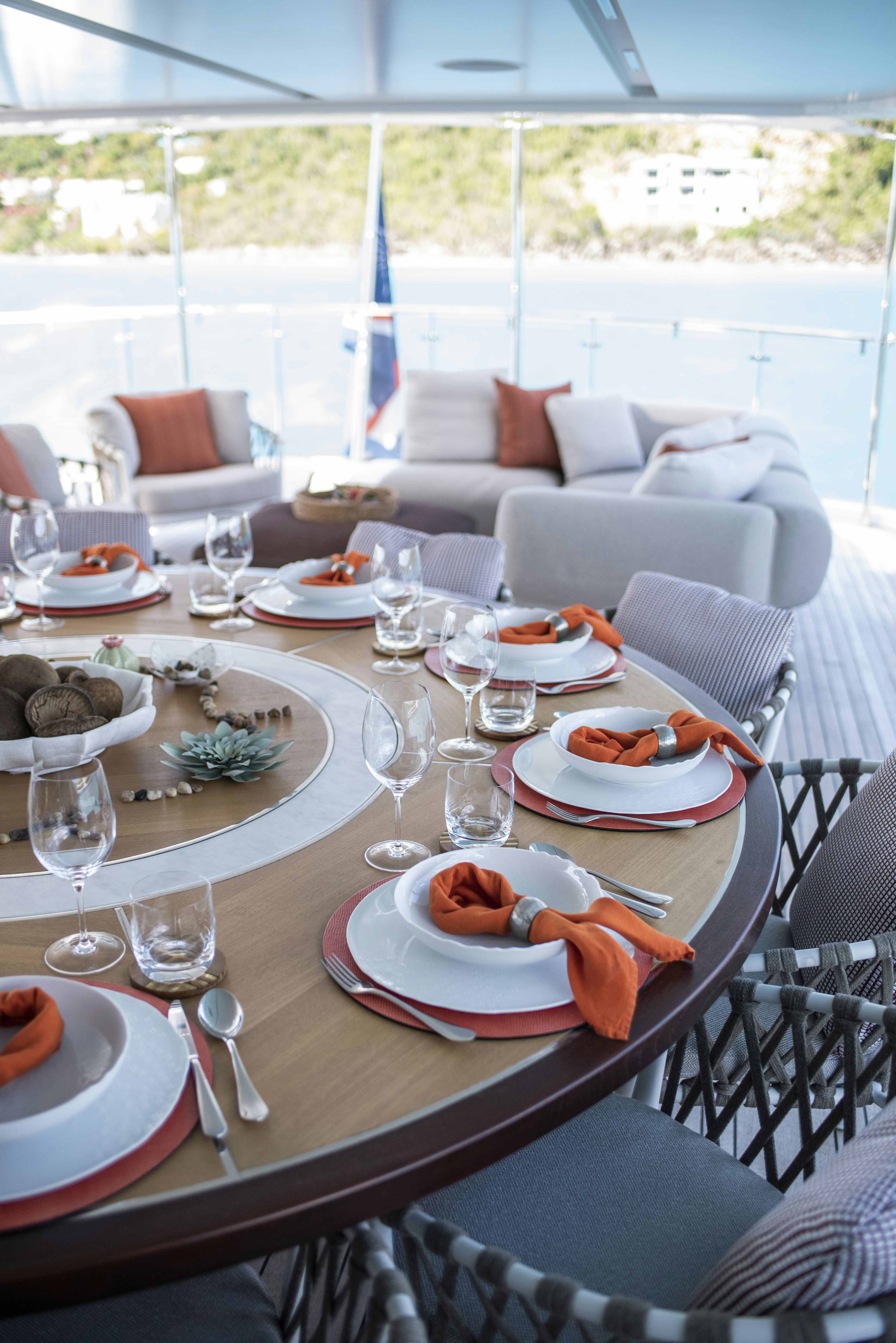 a table with plates and glasses on it aboard WABASH Yacht for Sale