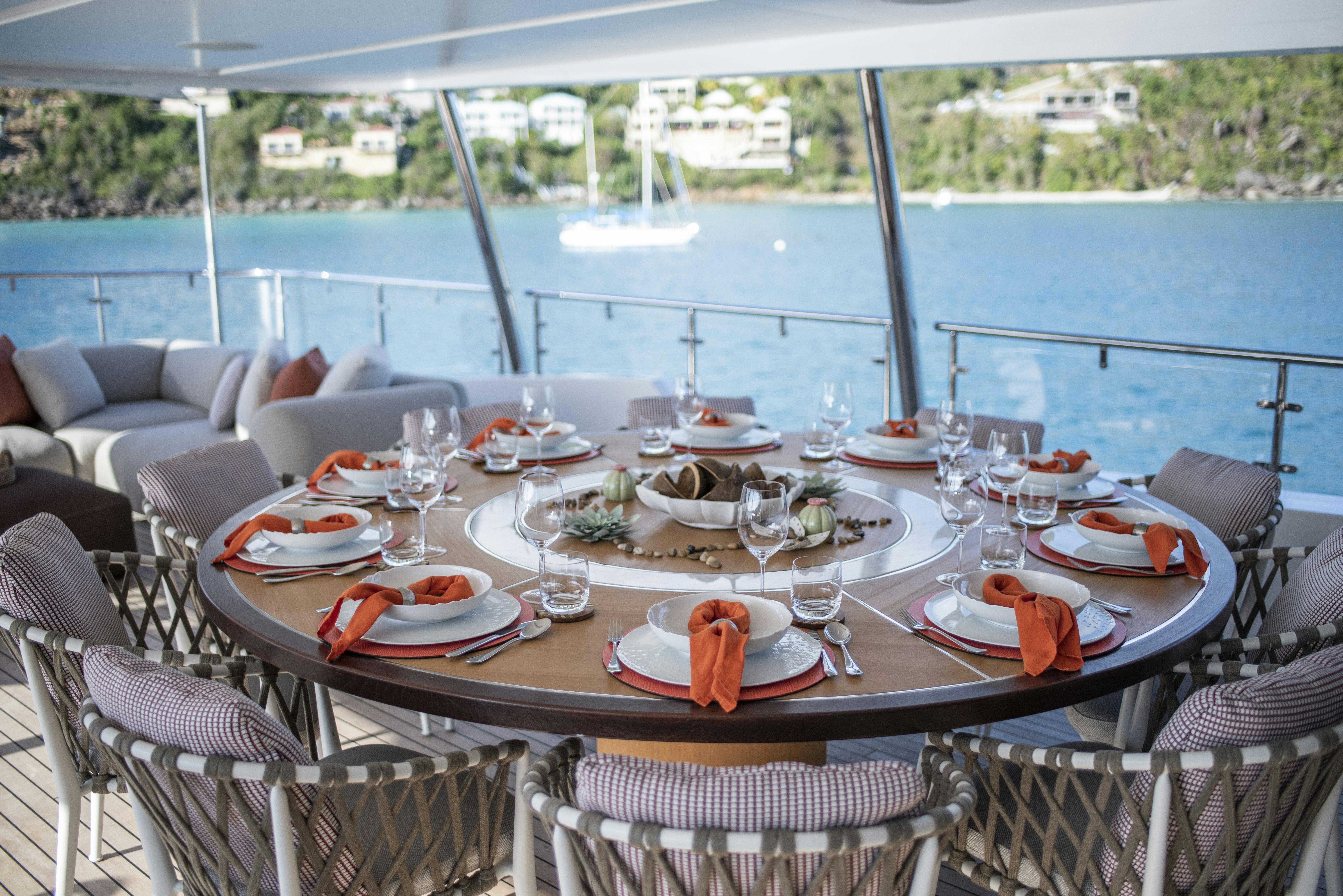 a table set for a dinner aboard WABASH Yacht for Sale
