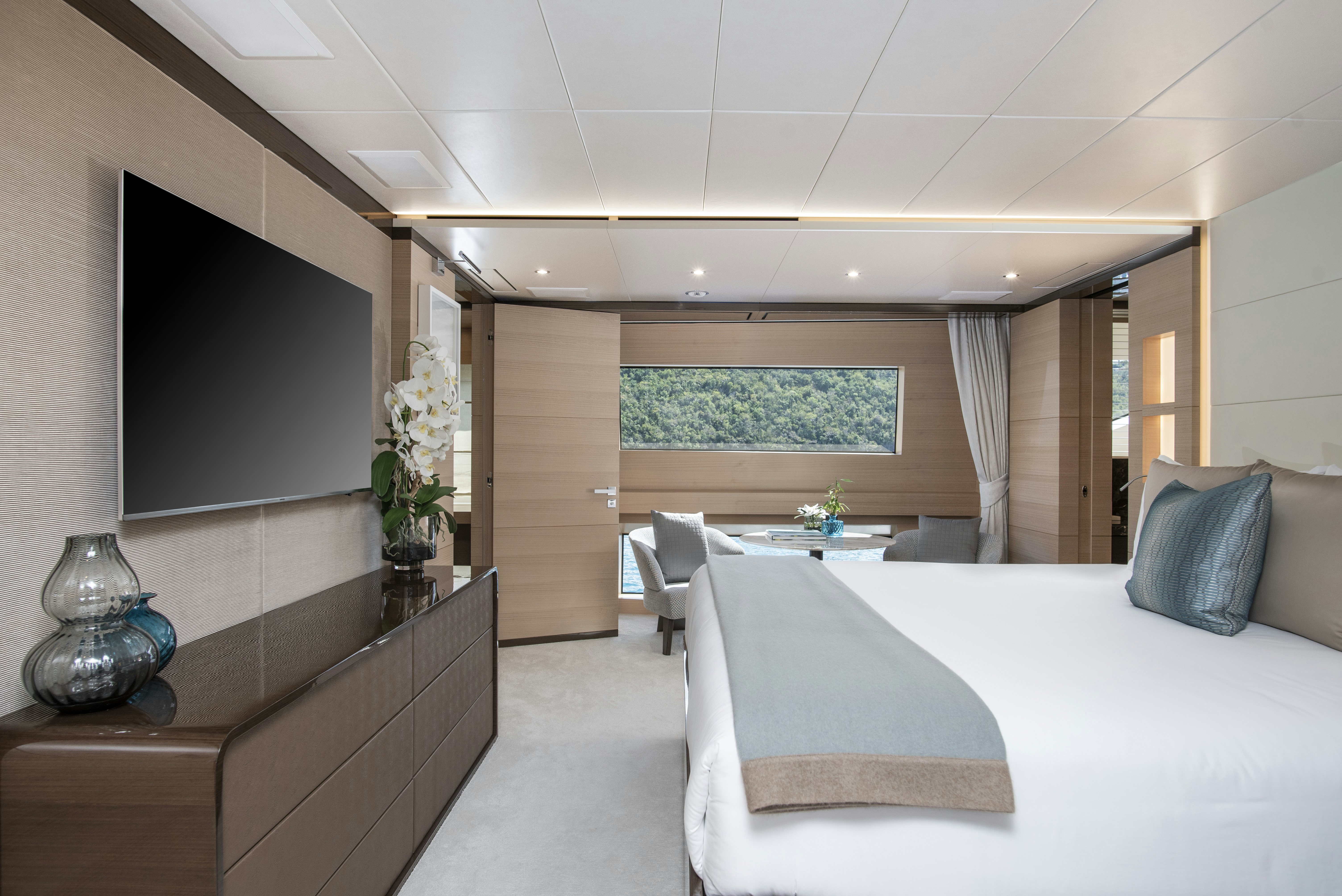 a room with a bed and a desk aboard WABASH Yacht for Sale