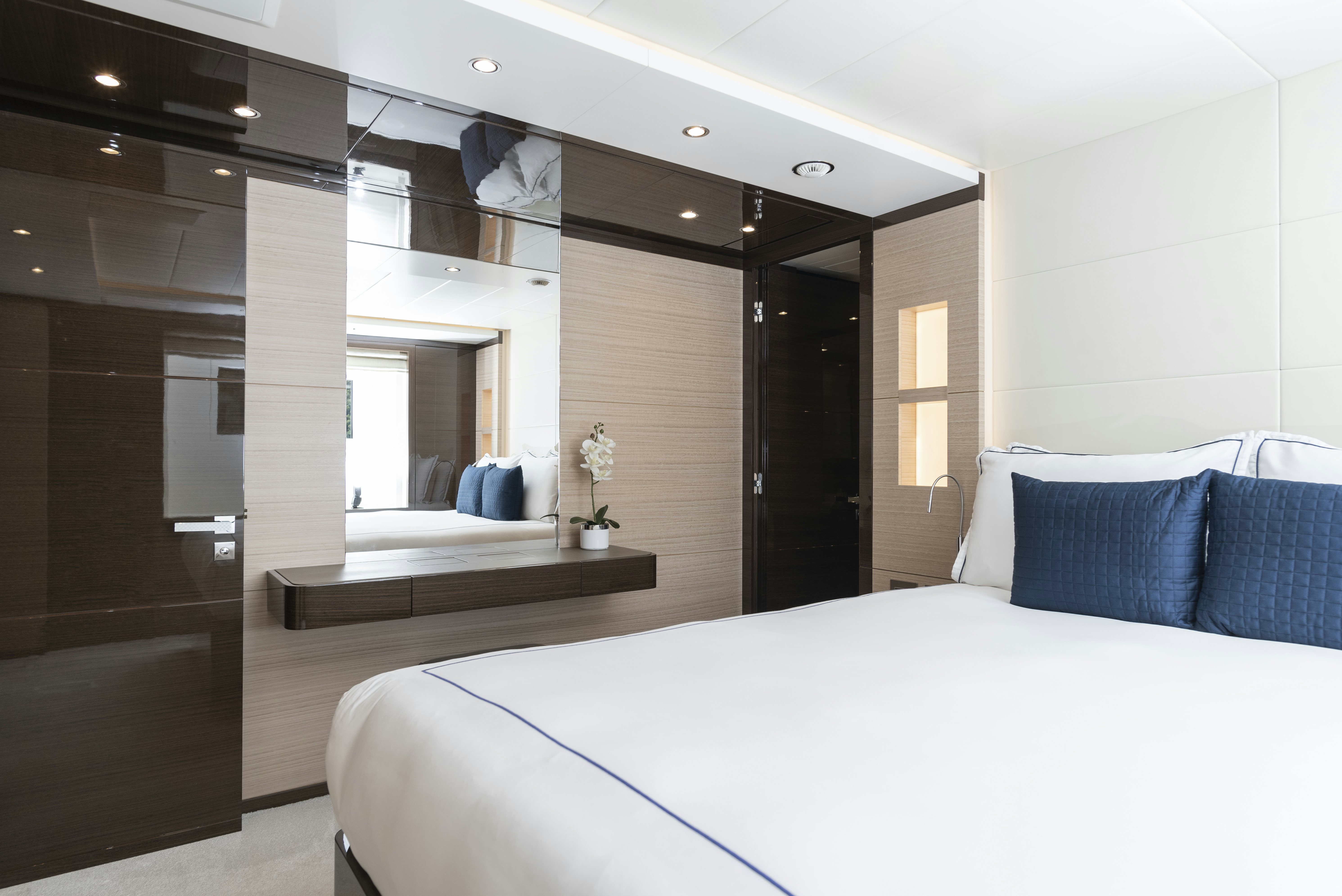 a room with a bed and a desk aboard WABASH Yacht for Sale