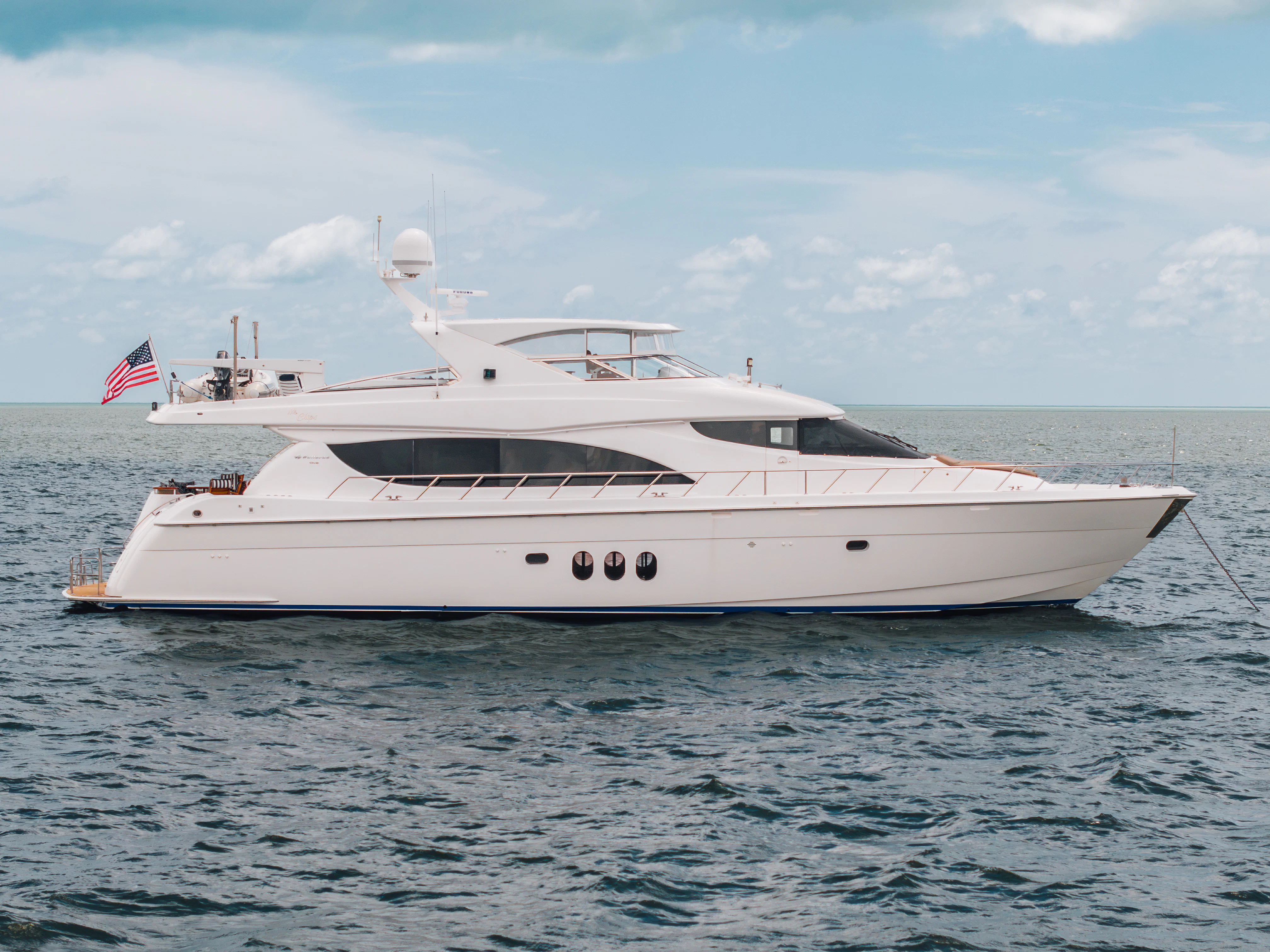 a white yacht in the water aboard MR. CHIPS Yacht for Sale