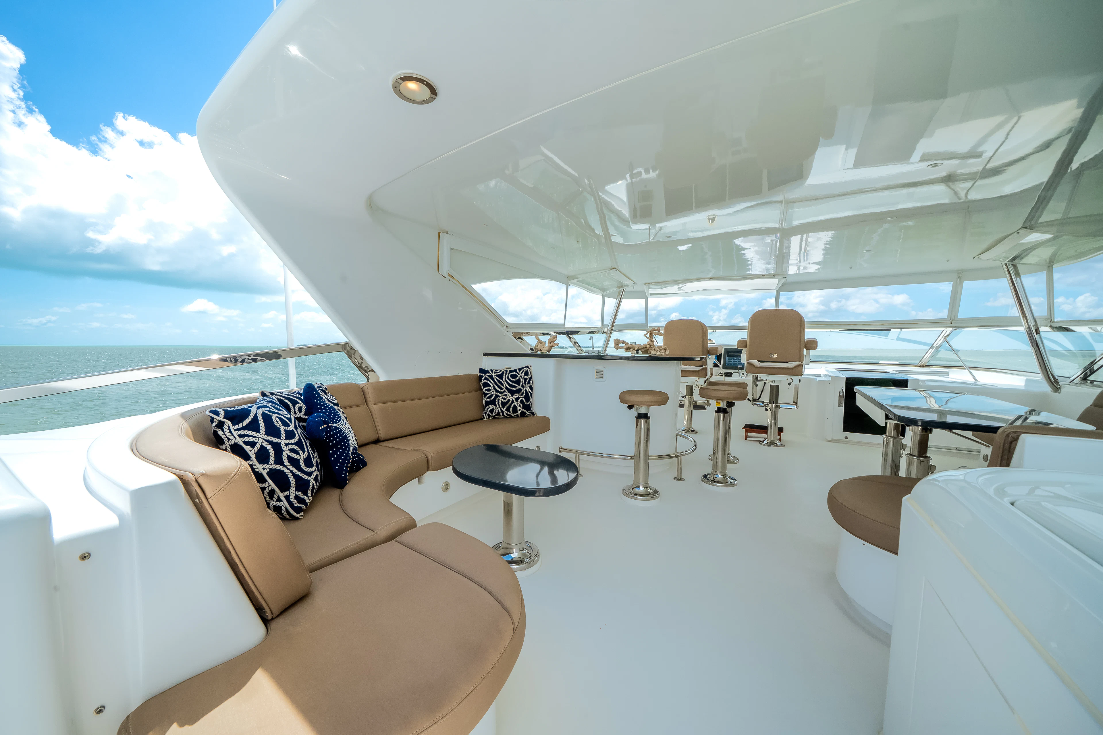 a room with a couch and chairs aboard MR. CHIPS Yacht for Sale