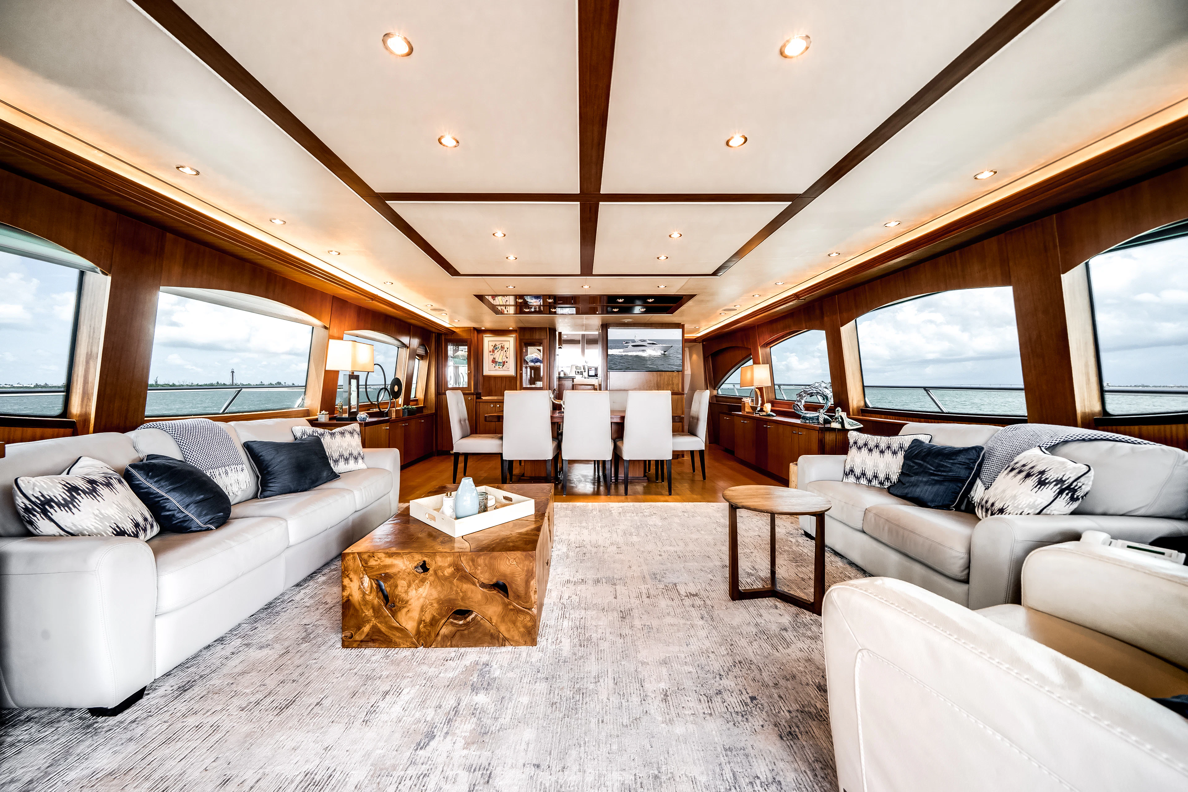 a living room with a couch and a table aboard MR. CHIPS Yacht for Sale