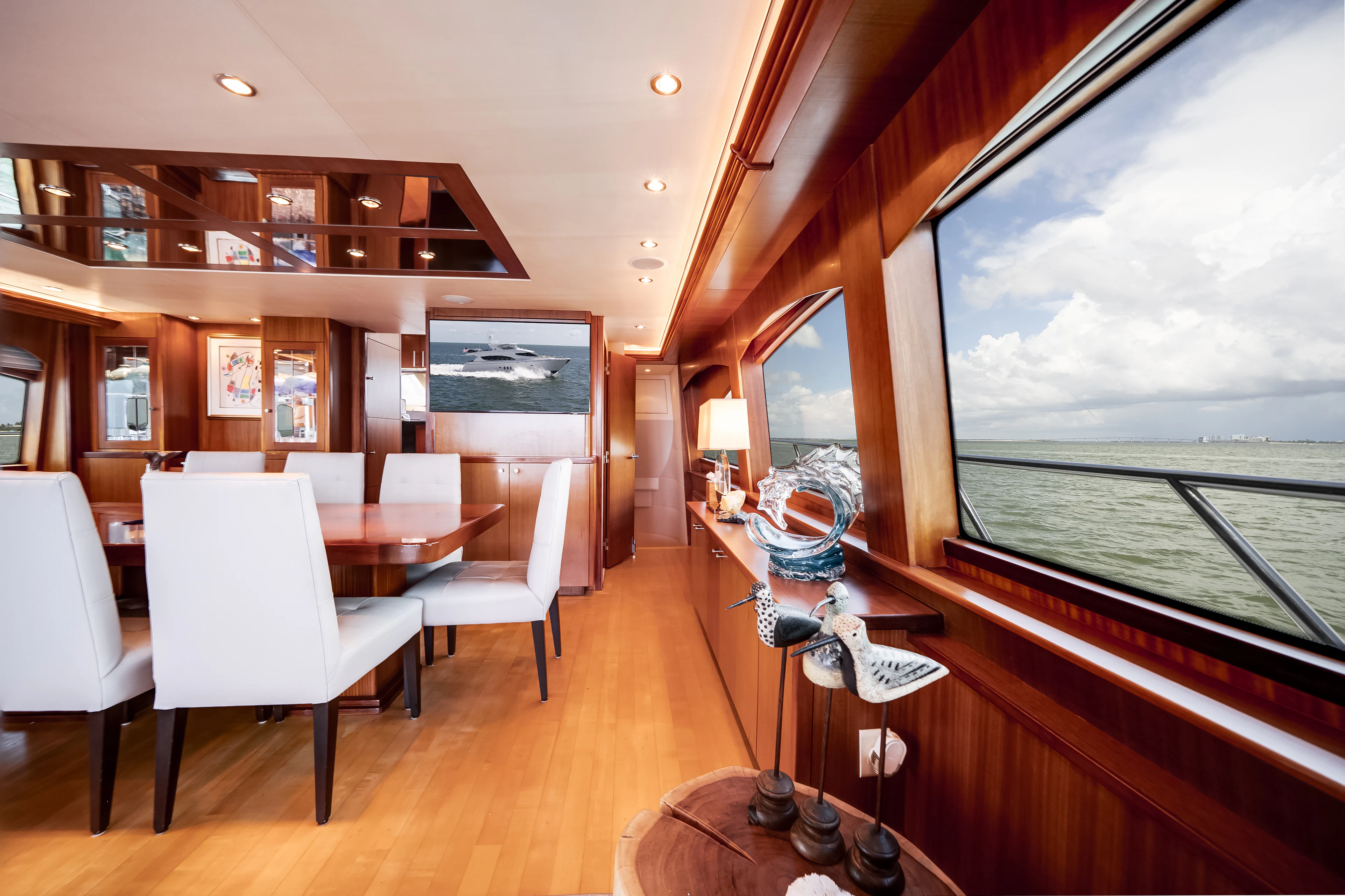 a room with a table and chairs aboard MR. CHIPS Yacht for Sale